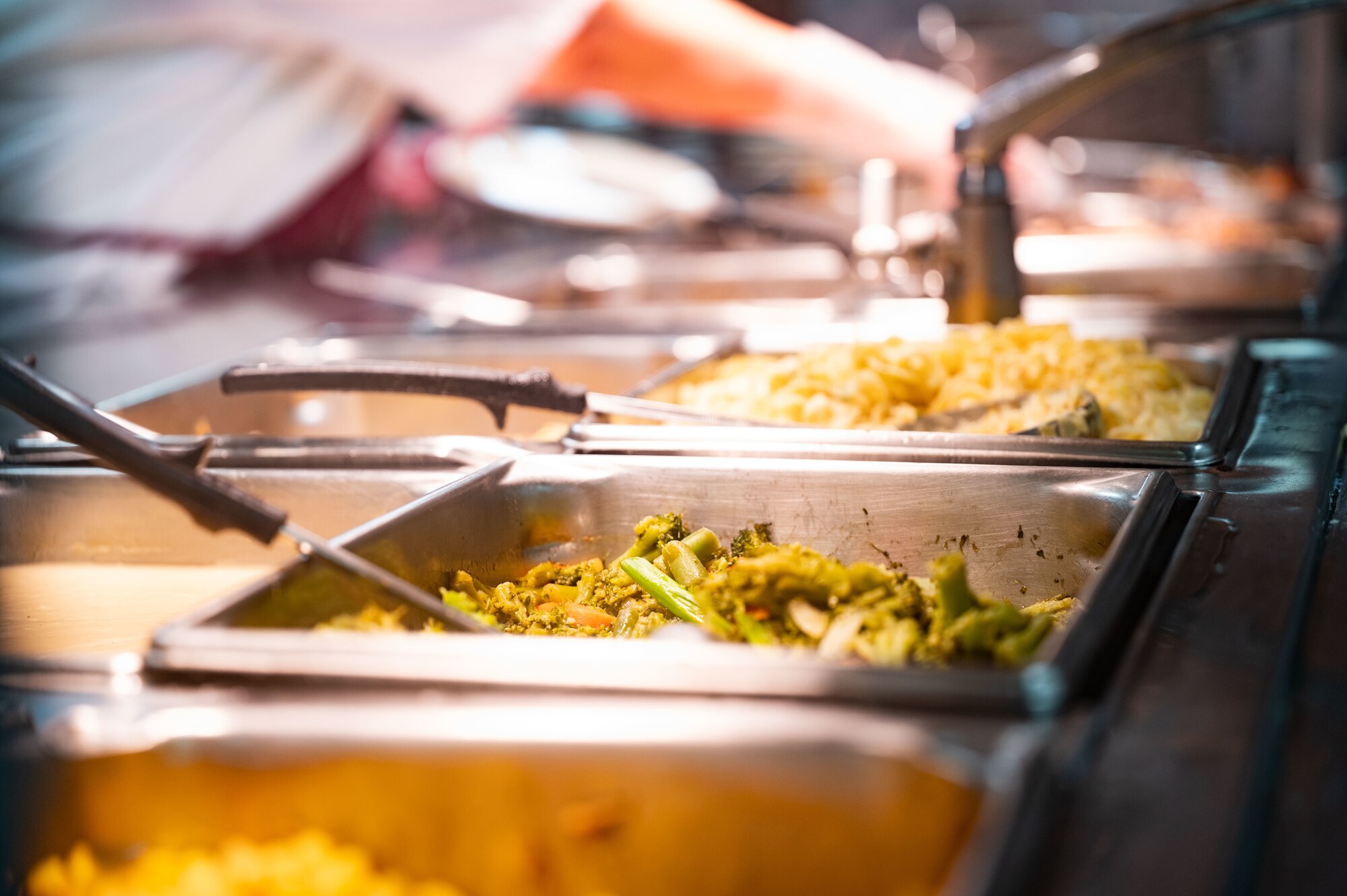 Green beans and corn in serving dishes at the dining facility