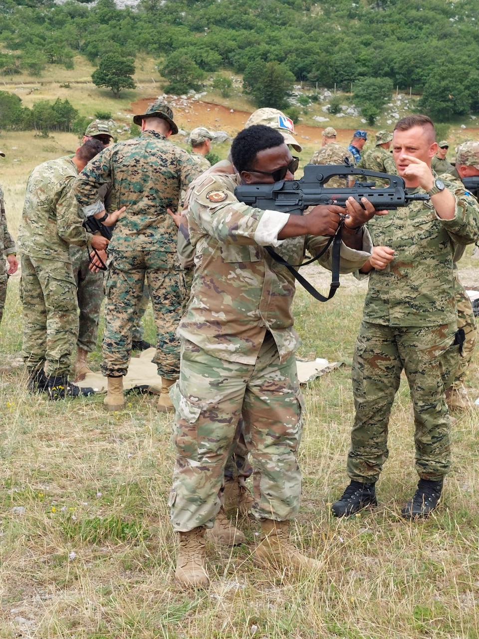 An airman shoots a weapon.