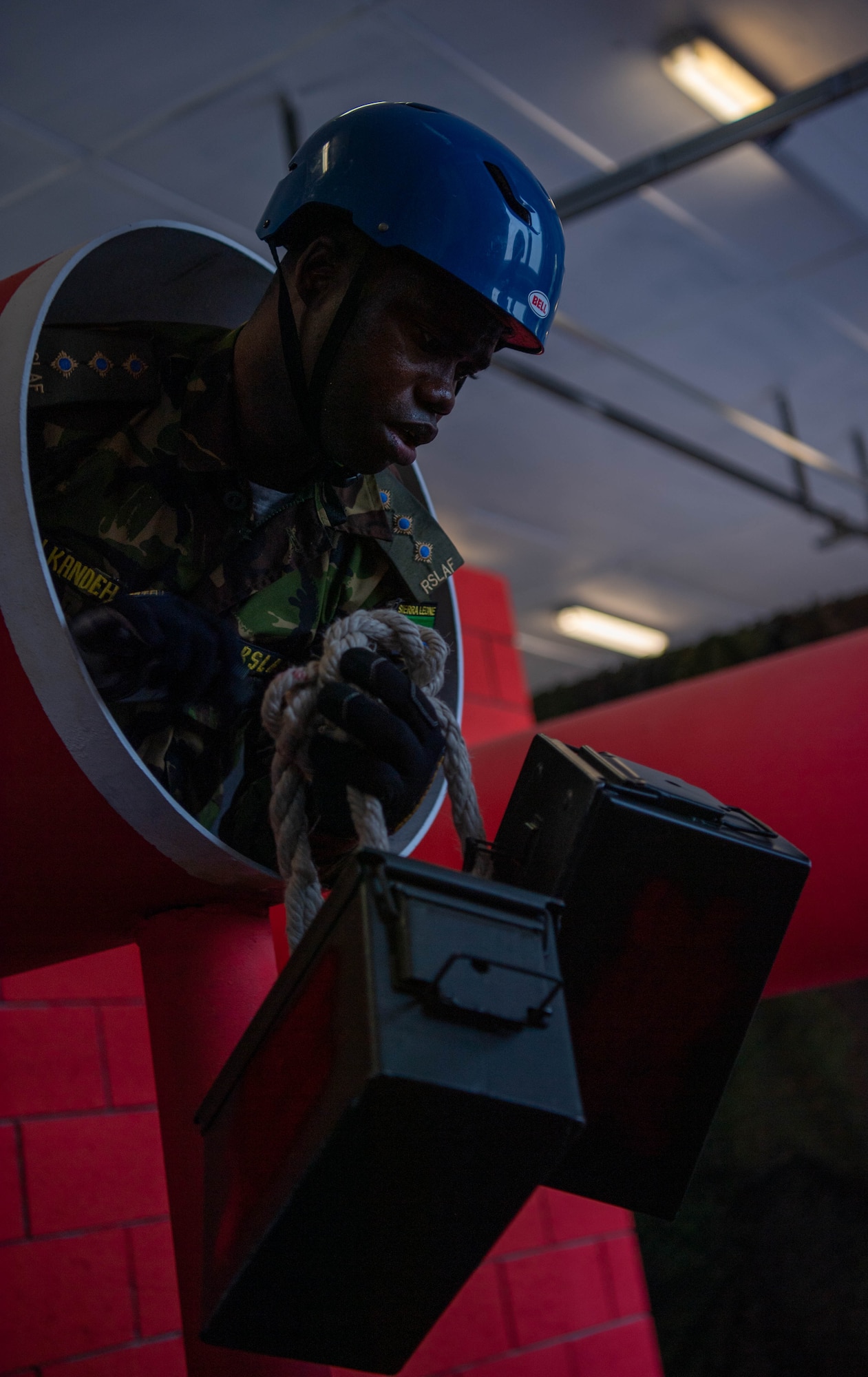 Republic of Sierra Leone Armed Forces Capt. Samuel Kandeh, Inter-African Professional Development Seminar student, leans out of a tunnel during an obstacle at Kapaun Air Station, Germany, July 19, 2023.