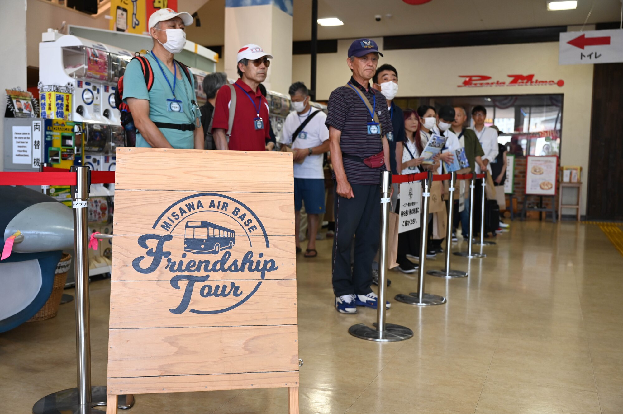 Participants of a Misawa Friendship Tour line up to receive a pre-tour brief before boarding a bus at Misawa City, Japan, July 14, 2023.