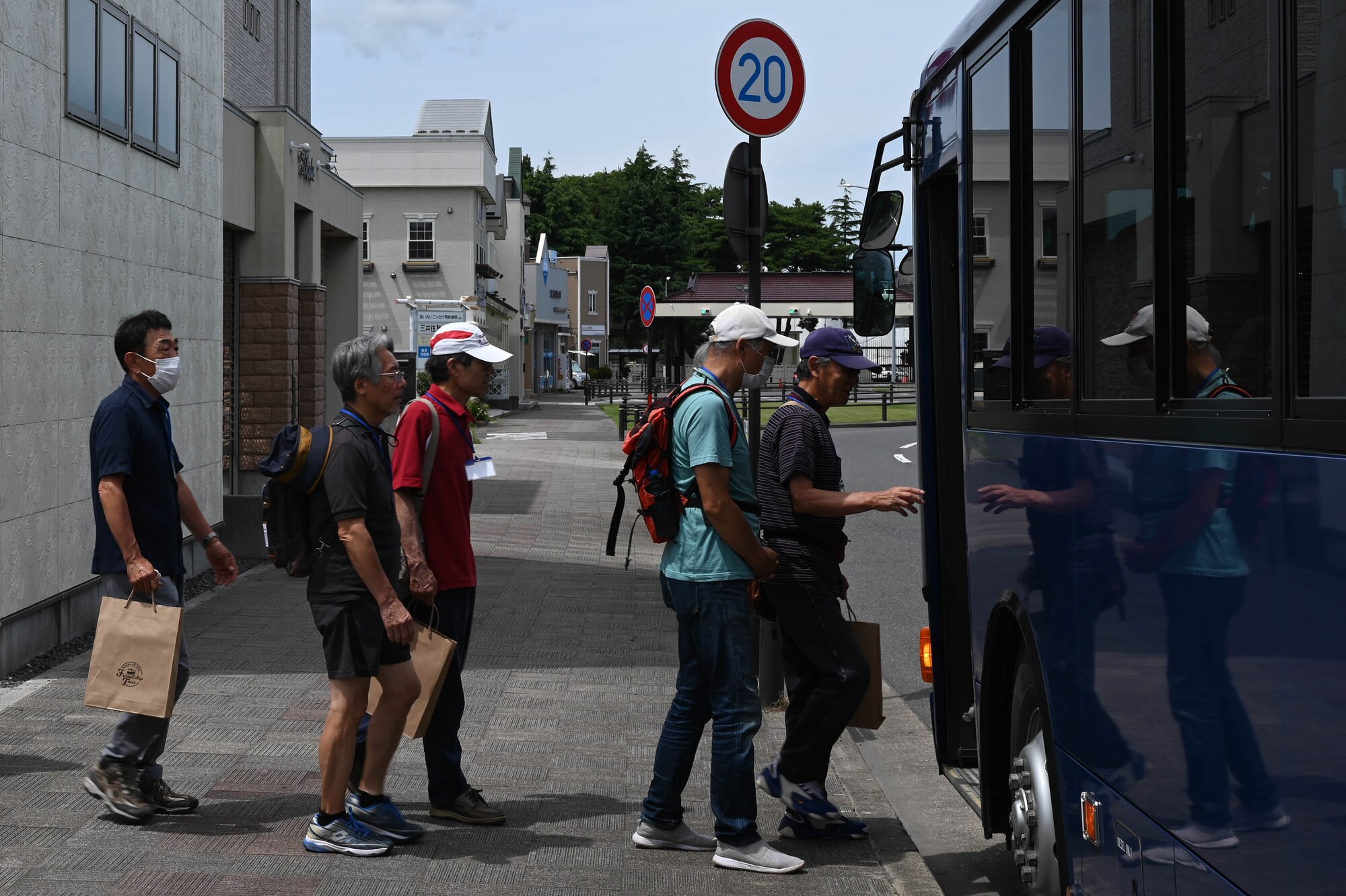 Participants of a Misawa Friendship Tour board a bus at Misawa City, Japan, July 14, 2023.