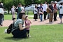 A mother and child participating in a Misawa Friendship Tour look at the different static displays located around Risner Circle at Misawa Air Base, Japan, July 14, 2023.