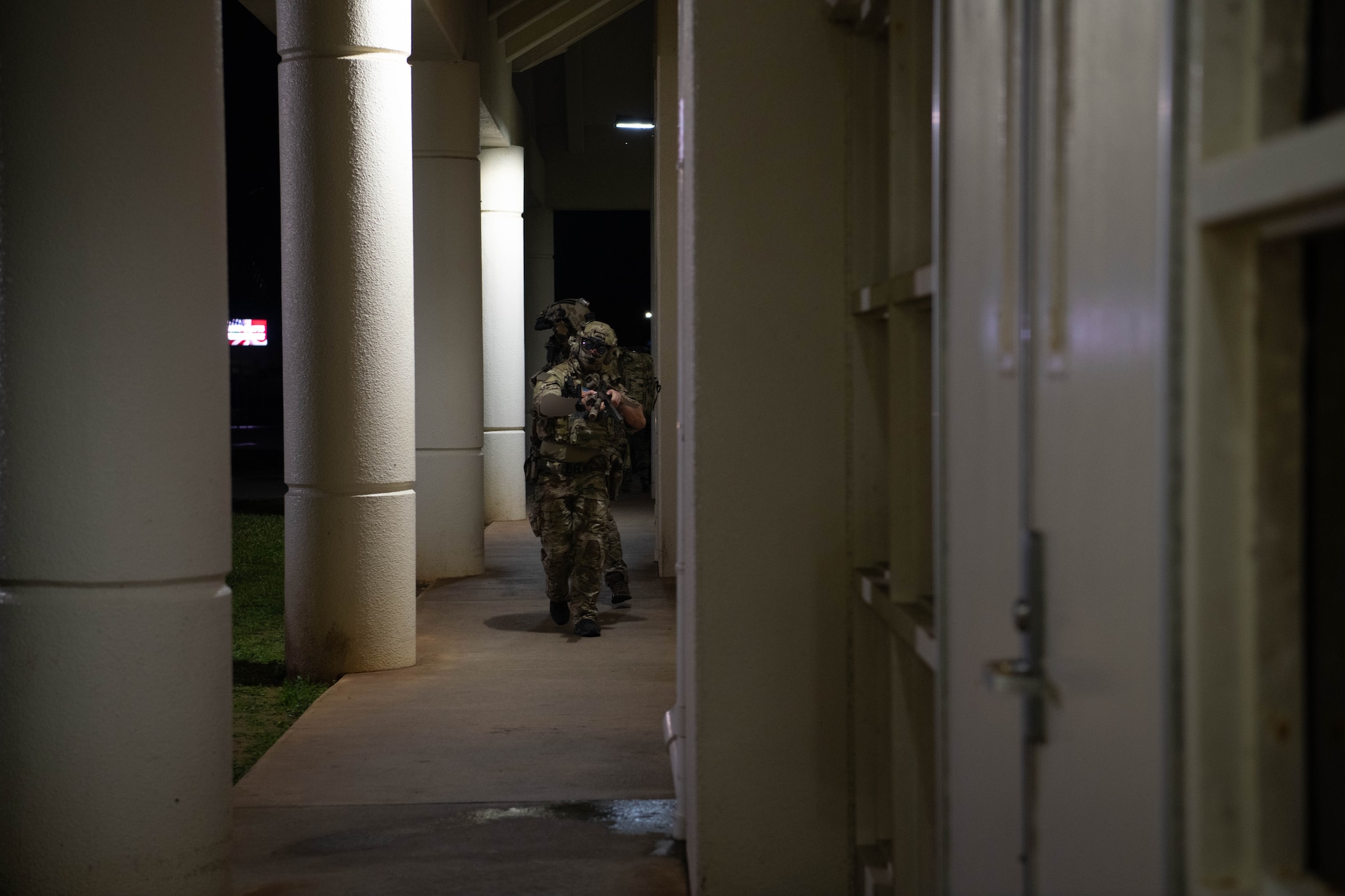 Green Berets secure outside of building.