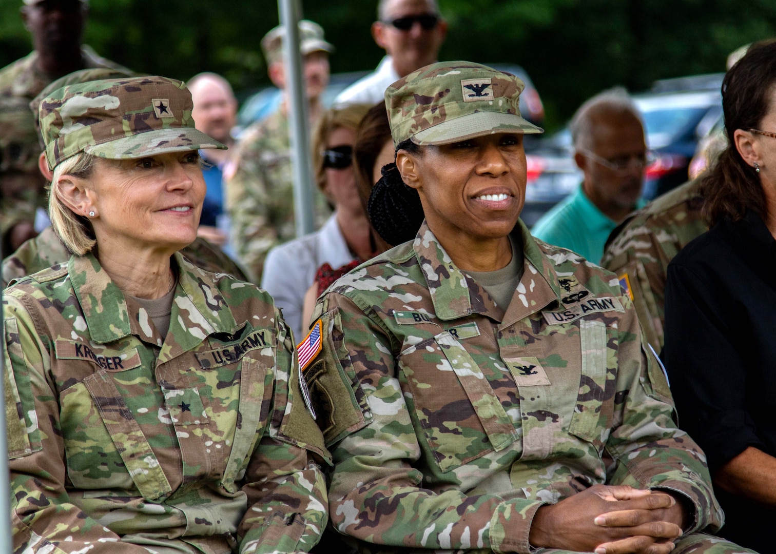 Col. Christina M. Buchner (right), the new commander of the U.S. Army Medical Department Activity, Fort Drum, sits next to Brig. Gen. Mary V. Krueger, commanding general of Medical Readiness Command, East, during the MEDDAC’s change of command ceremony at Memorial Park, Fort Drum, N.Y., July 21, 2023.