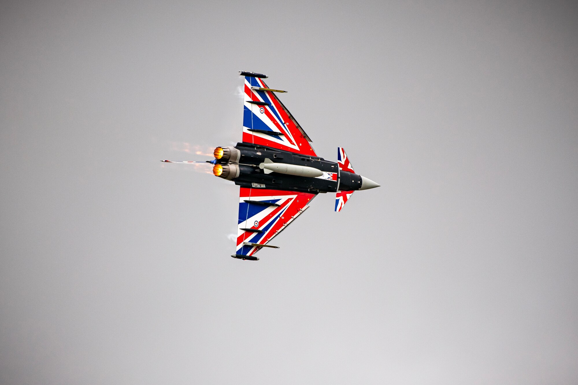 A Royal Air Force Eurofighter Typhoon FGR4 conducts an aerial demonstration during the 2023 Royal International Air Tattoo at RAF Fairford, England, July 15, 2023. Throughout RIAT, several nations exhibited their air power and capabilities for thousands of spectators helping inspire the next generation of aviation. (U.S. Air Force photo by Staff Sgt. Eugene Oliver)