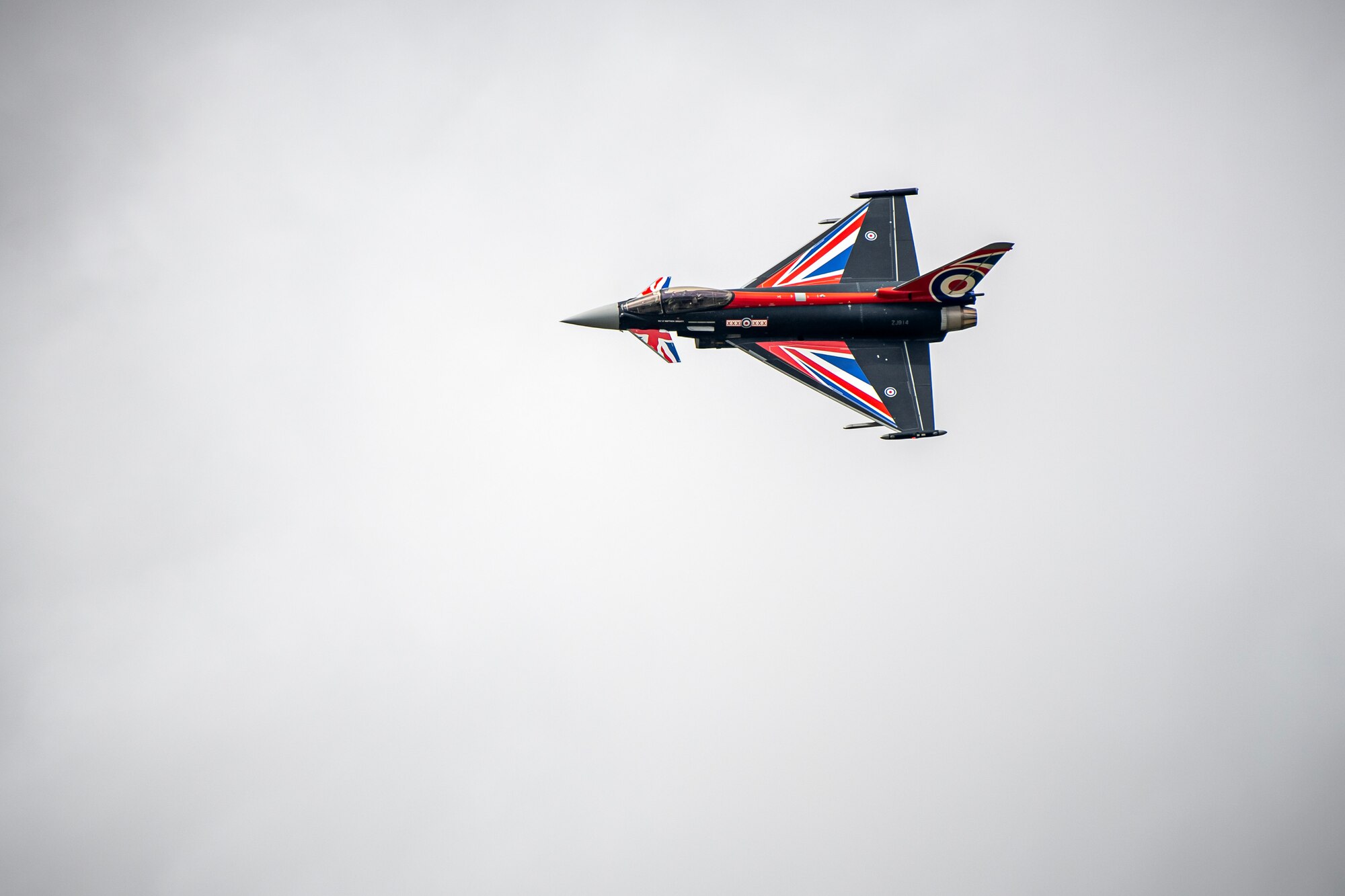 A Royal Air Force Eurofighter Typhoon FGR4 conducts an aerial demonstration during the 2023 Royal International Air Tattoo at RAF Fairford, England, July 15, 2023. Throughout RIAT, several nations exhibited their air power and capabilities for thousands of spectators helping inspire the next generation of aviation. (U.S. Air Force photo by Staff Sgt. Eugene Oliver)