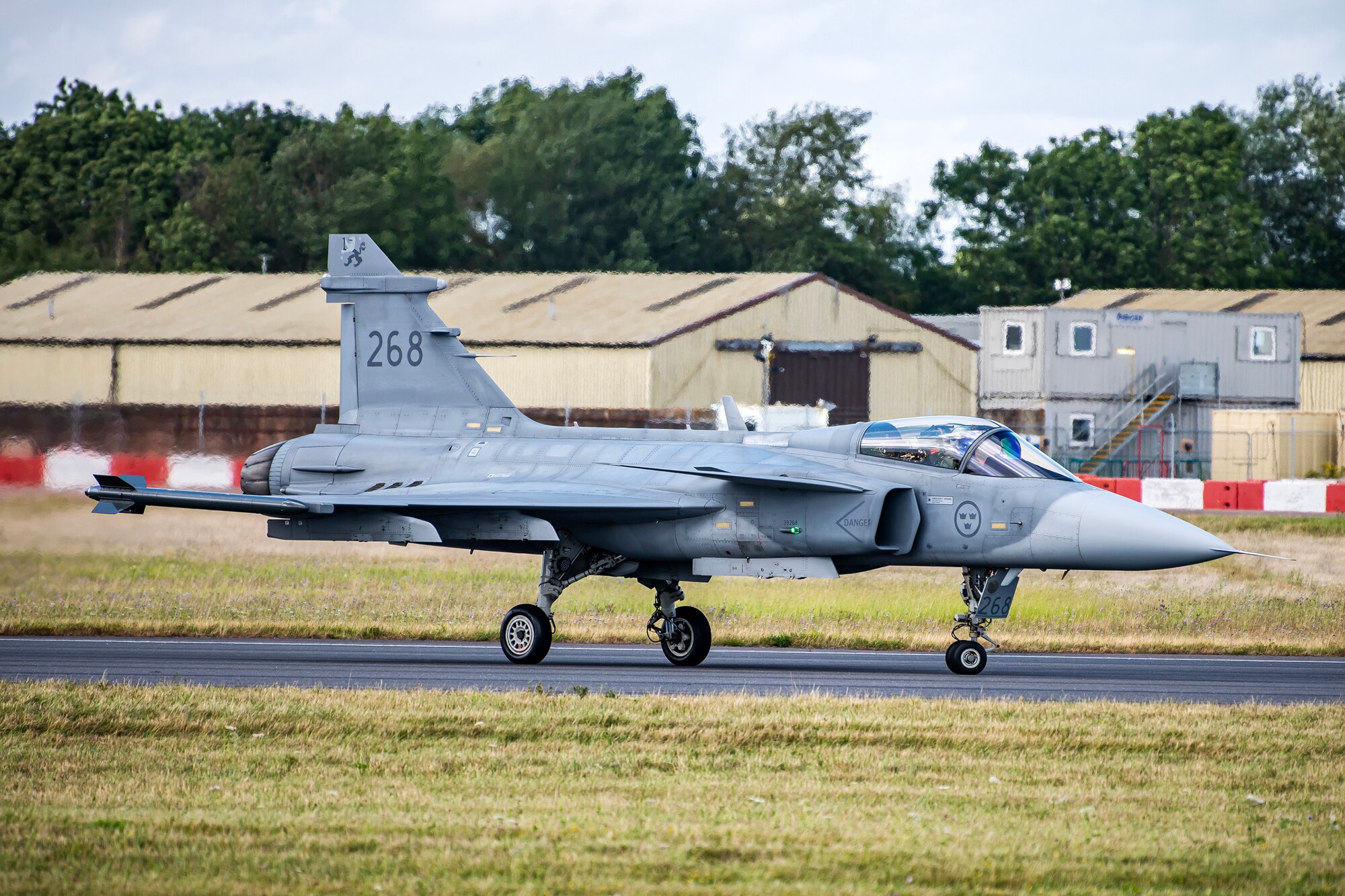 A Swedish Air Force JAS-39C Gripen taxis during the 2023 Royal International Air Tattoo at RAF Fairford, England, July 16, 2023. Throughout RIAT, several nations exhibited their air power and capabilities for thousands of spectators helping inspire the next generation of aviation. (U.S. Air Force photo by Staff Sgt. Eugene Oliver)