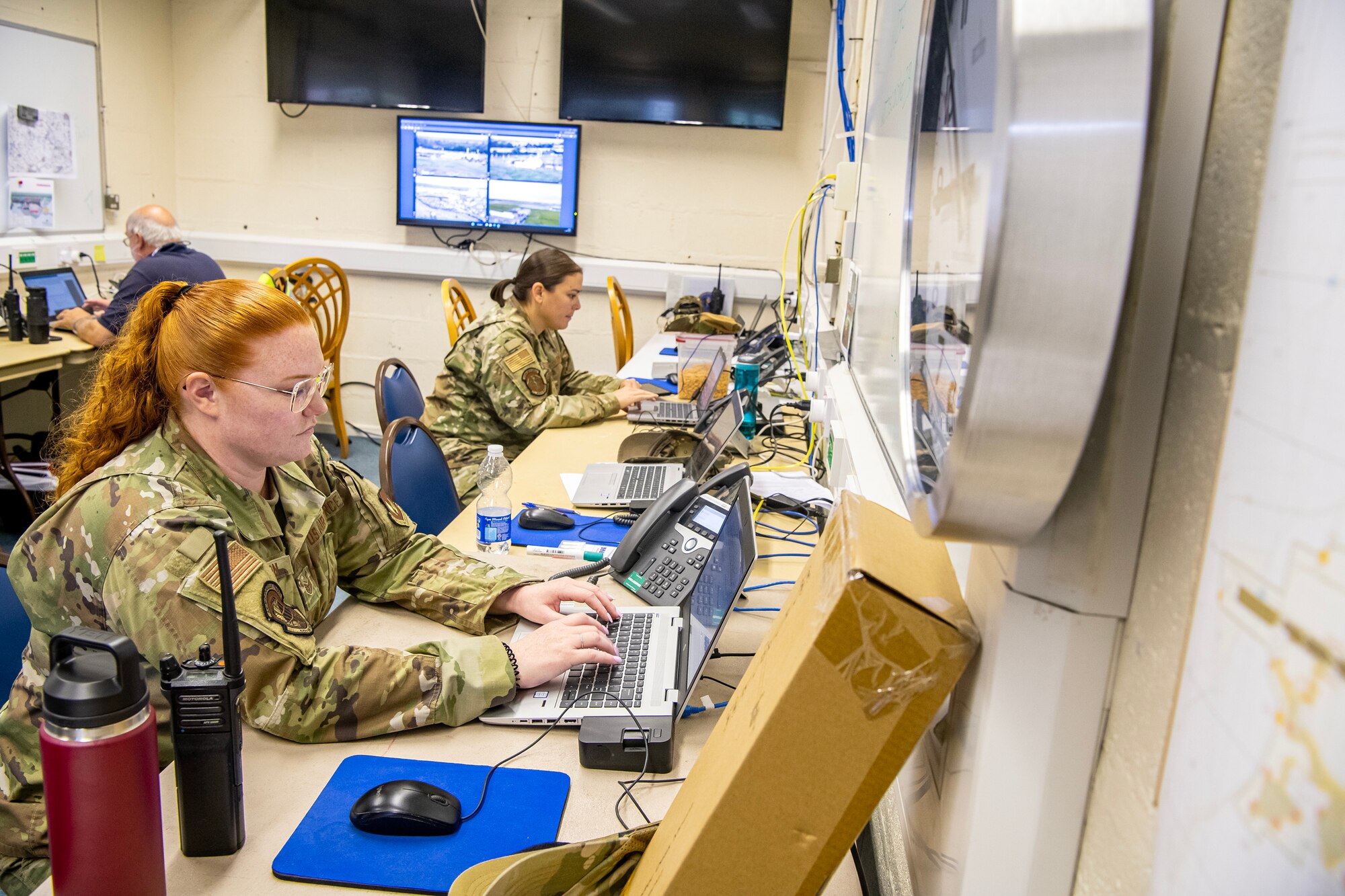 Members assigned to RAF Fairford provide Emergency Operations Center support during the 2023 Royal International Air Tattoo at RAF Fairford, England, July 15, 2023. Multiple Airmen deployed to and stationed at RAF Fairford provided security and emergency management services to ensure a successful air show. (U.S. Air Force photo by Staff Sgt. Eugene Oliver)