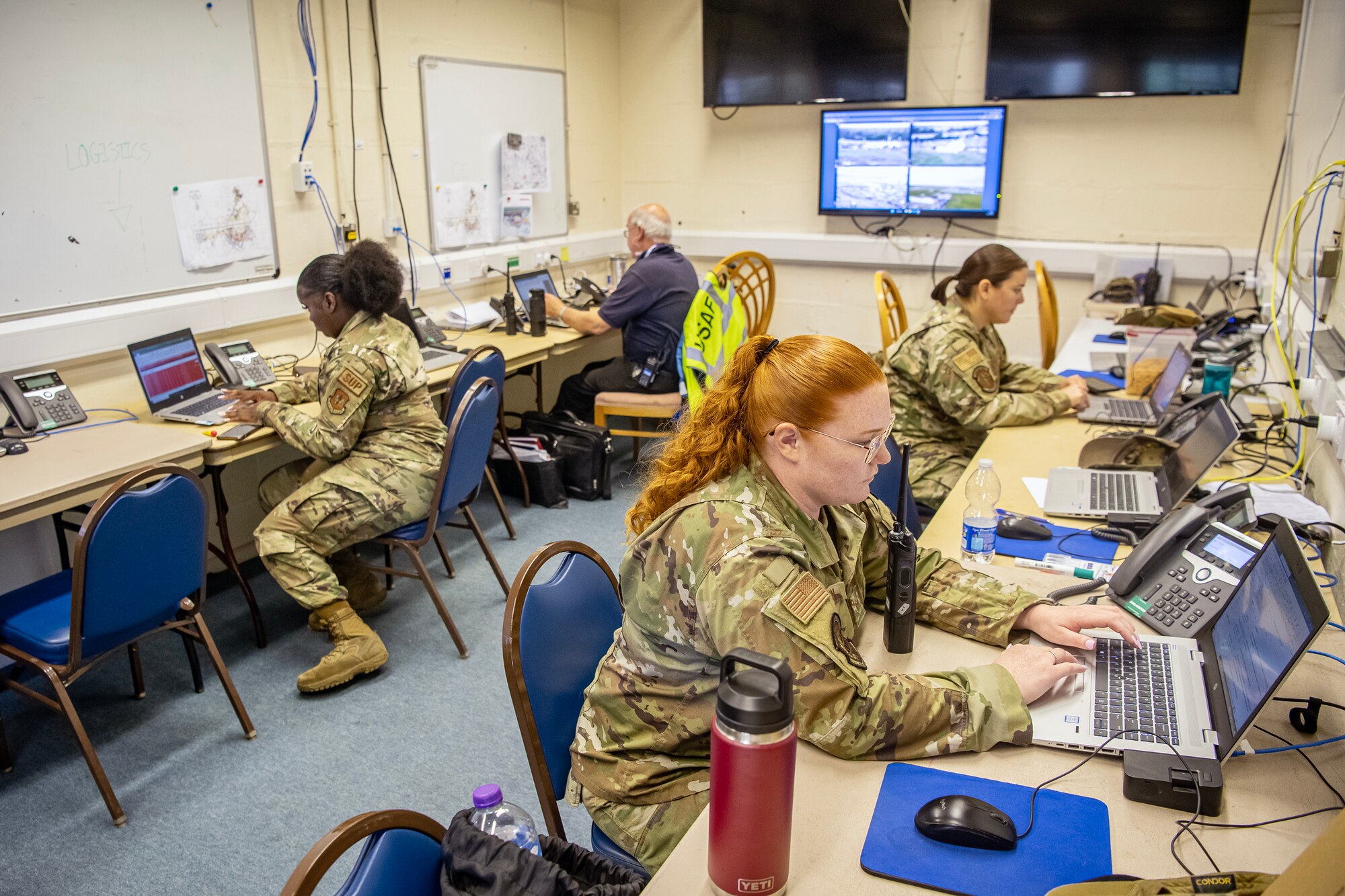 Members assigned to RAF Fairford provide Emergency Operations Center support during the 2023 Royal International Air Tattoo at RAF Fairford, England, July 15, 2023. Multiple Airmen deployed to and stationed at RAF Fairford provided security and emergency management services to ensure a successful air show. (U.S. Air Force photo by Staff Sgt. Eugene Oliver)