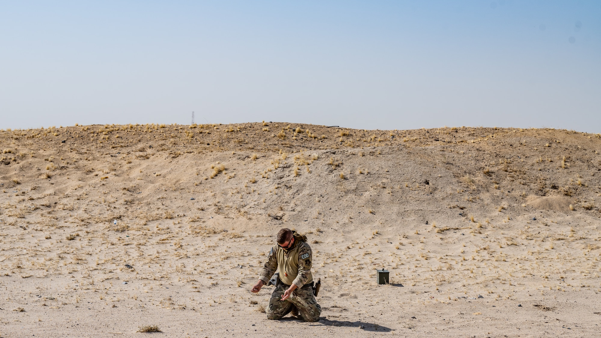 A U.S. Air Force explosive ordnance disposal (EOD) technician assigned to the 386th Expeditionary Civil Engineer Squadron lays out a detonation cord near Ali Al Salem Air Base, Kuwait, July 21, 2023. EOD technicians are experts in the safe handling and destruction of chemical, biological, incendiary, radiological and nuclear materials and devices, and they help ensure freedom of operations by removing such hazards. (U.S. Air Force photo by Staff Sgt. Kevin Long)