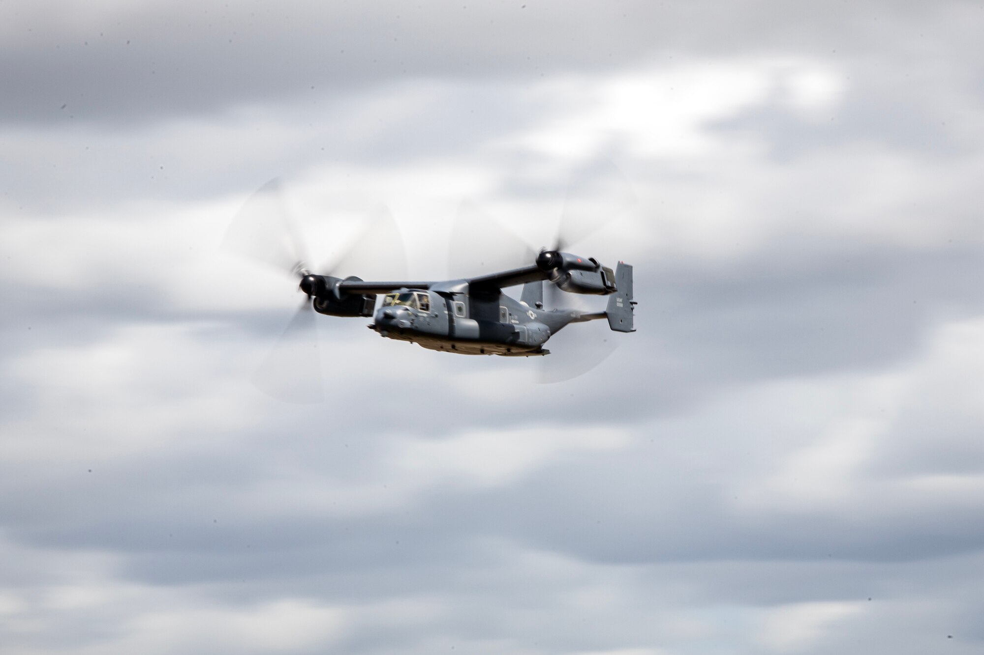 A CV-22B Osprey from RAF Mildenhall conducts an aerial demonstration during the 2023 Royal International Air Tattoo at RAF Fairford, England, July 16, 2023. RIAT participation demonstrates U.S. commitment to European allies and partners while highlighting U.S. capabilities to a diverse audience, emphasizing unity, innovation, and a shared commitment to excellence. (U.S. Air Force photo by Staff Sgt. Eugene Oliver)