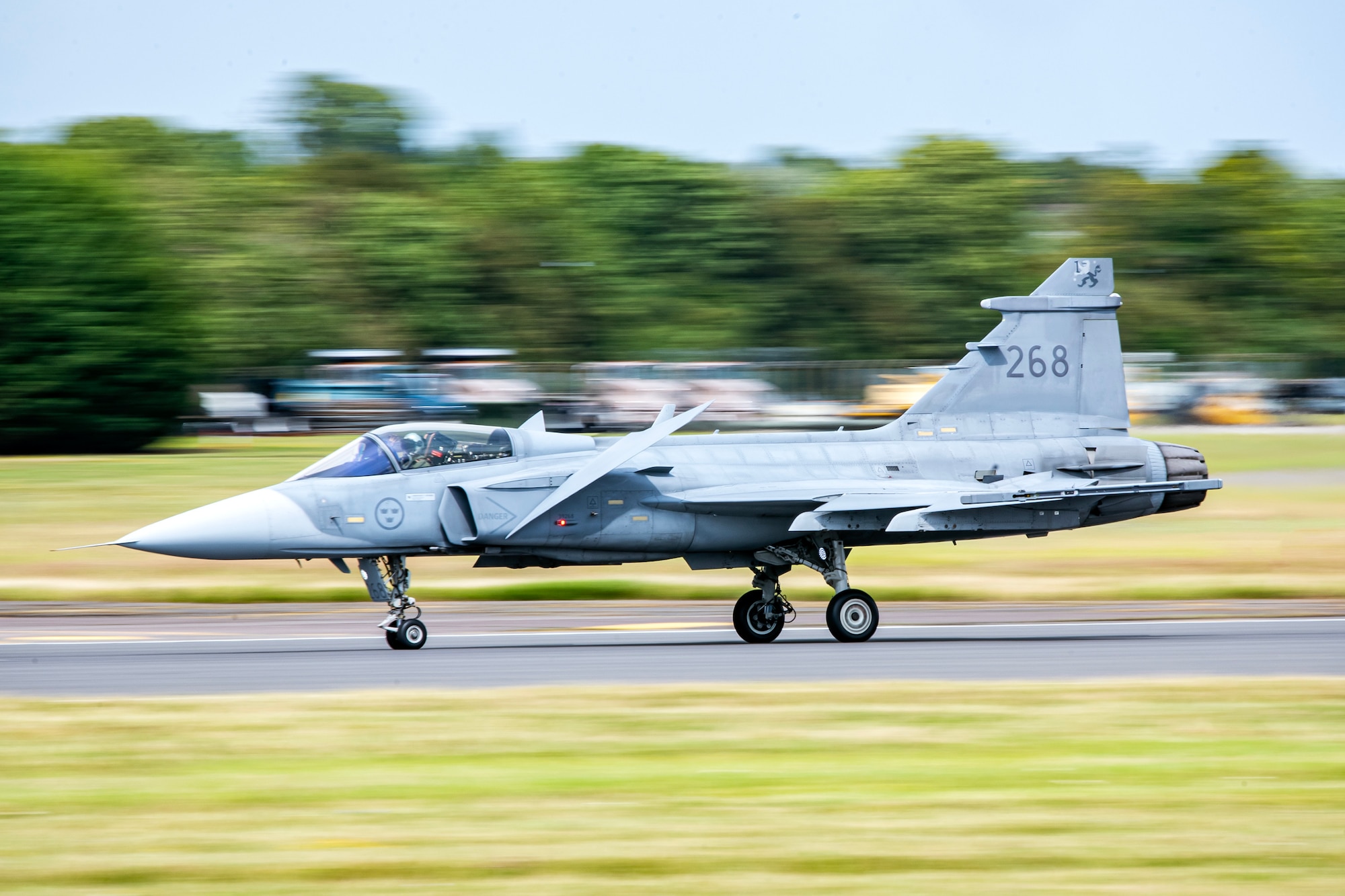 A Swedish Air Force JAS-39C Gripen takes off during the 2023 Royal International Air Tattoo at RAF Fairford, England, July 16, 2023. Throughout RIAT, several nations exhibited their air power and capabilities for thousands of spectators helping inspire the next generation of aviation. (U.S. Air Force photo by Staff Sgt. Eugene Oliver)