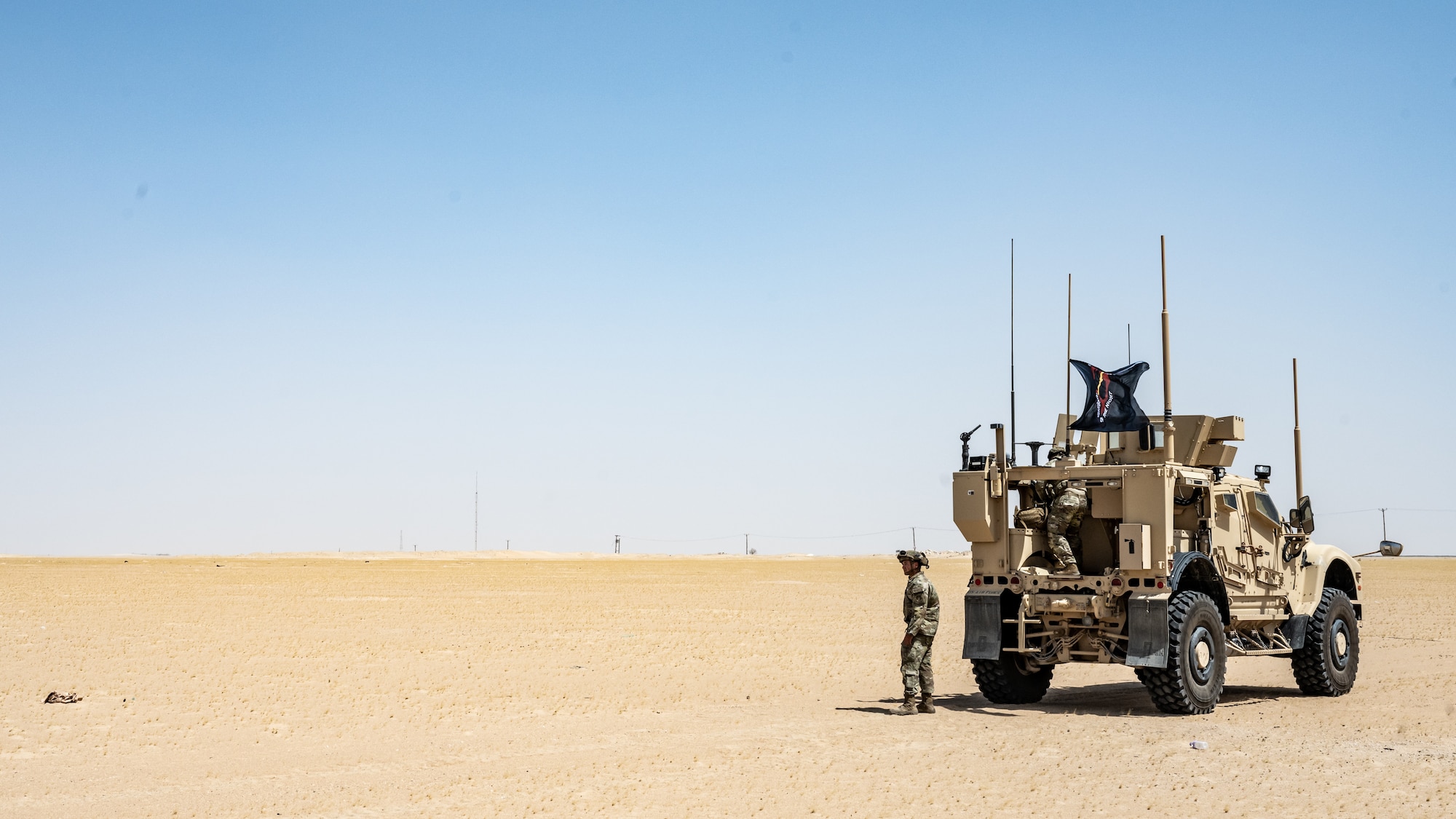 U.S. Air Force Staff Sgt. Bailey Paxson, 386th Expeditionary Security Forces Squadron vehicle control officer, stands next to a Mine Resistant Ambush Protected All-Terrain Vehicle (M-ATV) during vehicle familiarity training at Ali Al Salem Air Base, Kuwait, July 13, 2023. The M-ATV is designed to provide the same levels of protection as the larger and heavier vehicles, but with enhanced mobility in the region’s rough terrain. (U.S. Air Force photo by Staff Sgt. Kevin Long)