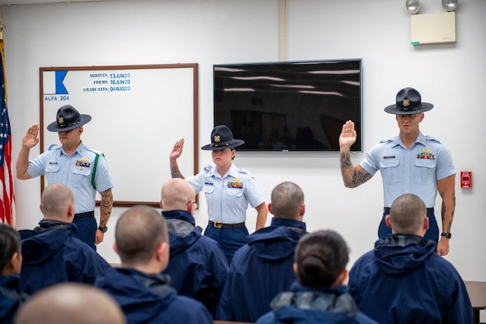 Recruits from Alpha-204 meet their company commanders and begin recruit training during a ceremony at U.S. Coast Guard Training Center Cape May, June 16, 2022. Training Center Cape May staff members look forward to continuing the Coast Guard's Long Blue Line of developing fleet-ready women and men, who are ready to make a difference in our Coast Guard. (U.S. Coast Guard photo by Petty Officer 2nd Class Gregory Schell)