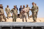Lt. Gen. Patrick Frank, commanding general of U.S. Army Central, and Col. Fahad A. Buresli with the Kuwait Land Forces receive a capabilities briefing during the USARCENT autonomous vehicle demonstration at the Udari Range Complex near Camp Buerhing, Kuwait, on July 25, 2023. The 371st Sustainment Brigade is currently testing three semi-autonomous palletized load systems, or PLS. The bold measures USARCENT intends to pursue regarding innovation and experimentation will enable USARCENT to campaign creatively, contribute to cross-domain integrated deterrence, and support the effort to build enduring advantages. (U.S. Army Reserve photo by Spc. David Campos-Contreras)