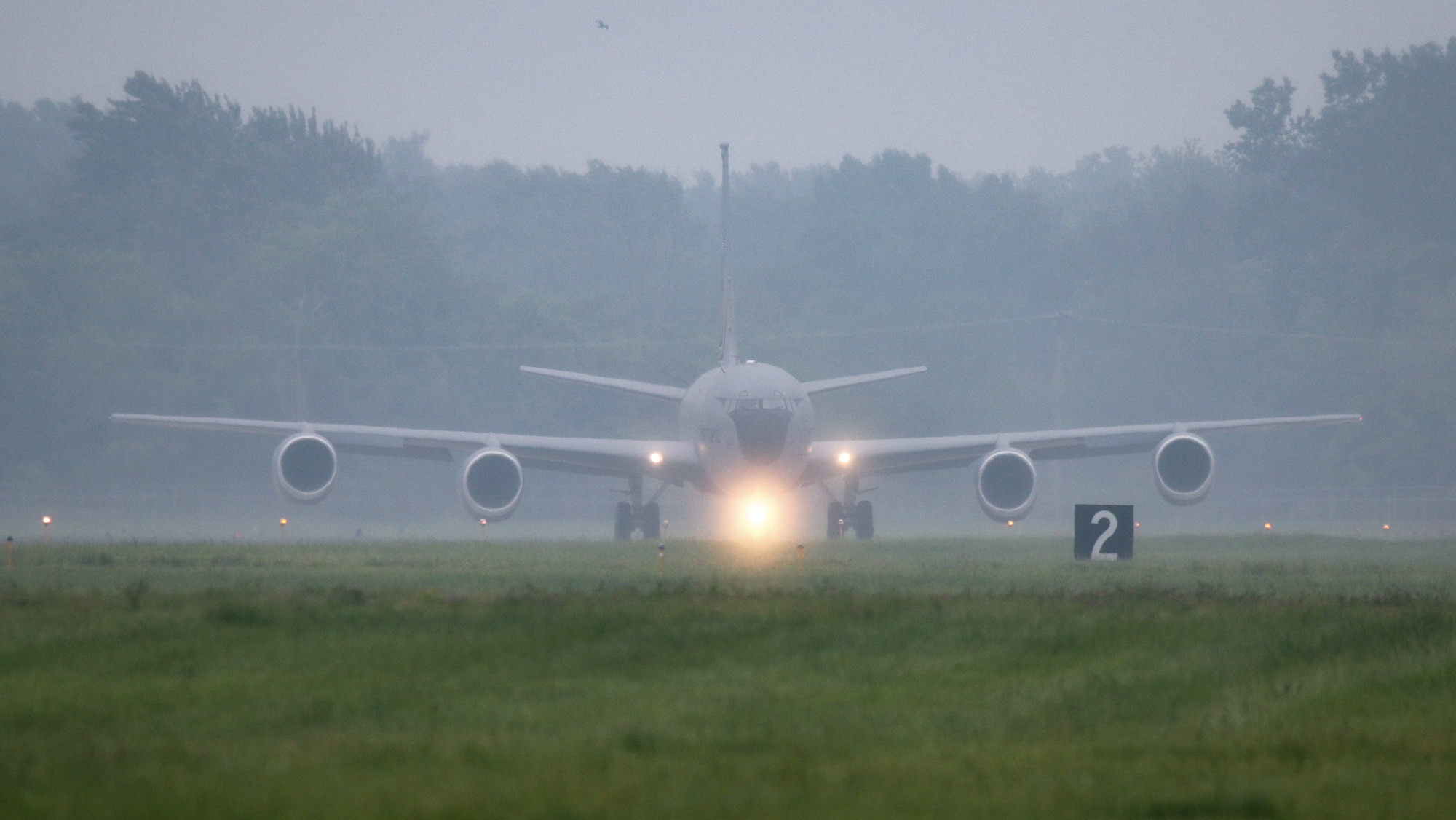 KC-135 aircraft prepares to take off on a runway.