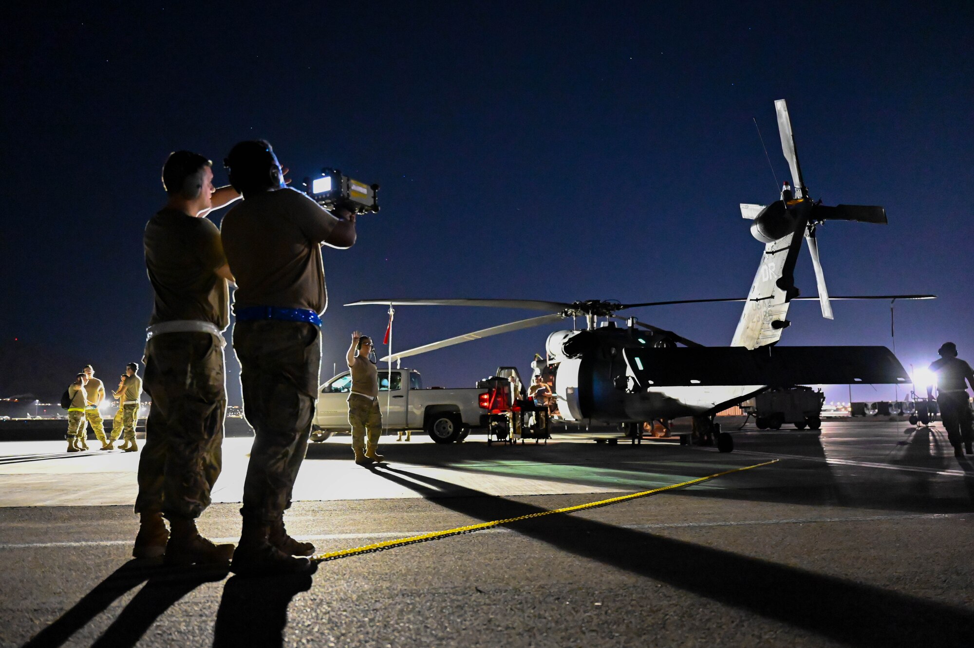 Airmen from the 87th Electronic Warfare Squadron conduct a missile systems operations check on an HH-60G Pavehawk as part of COMBAT SHIELD during Red Flag 23-3 at Nellis Air Force Base, Nev., July 14, 2023. The equipment simulates a threat to the aircraft which the on-board-system will detect. (U.S. Air Force photo by Capt. Benjamin Aronson)