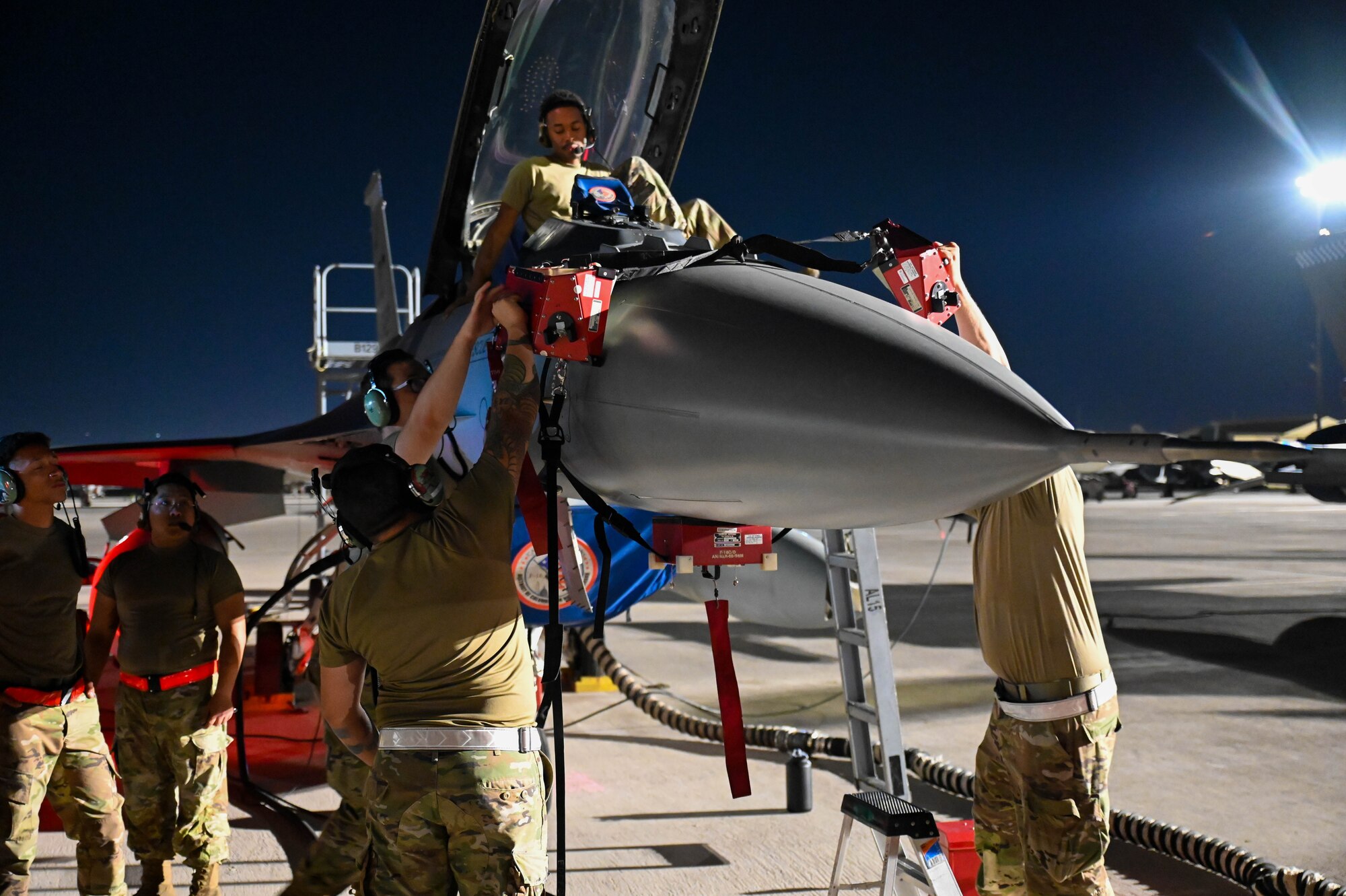 Airmen from the 87th Electronic Warfare Squadron perform COMBAT SHIELD electronic warfare assessments on an F-16 Fighting Falcon at Nellis Air Force Base, Nev., July 13, 2023. The 87th EWS evaluated the EW systems of the aircraft to ensure readiness. (U.S. Air Force photo by Capt. Benjamin Aronson)