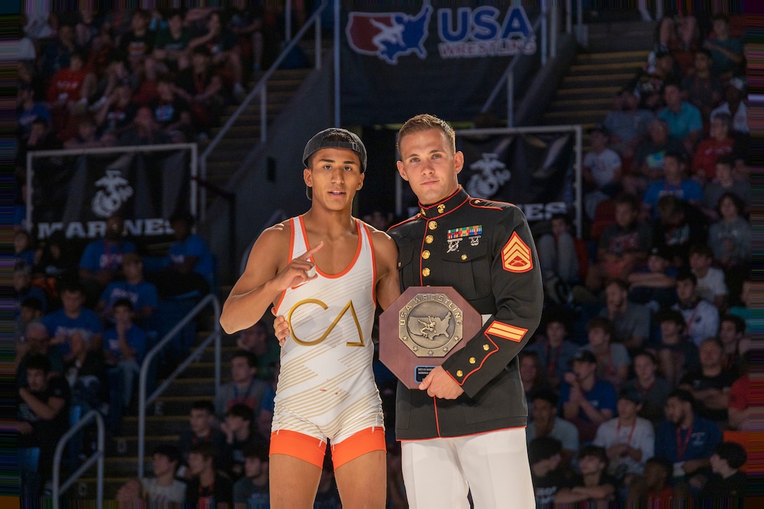 U.S. Marine Corps Staff Sgt. Albert Ludwig, a Martial Arts Instructor with MAF-C, operates the Marine Corps booth during the USA Wrestling Junior & 16U National Championships, sponsored by the Marine Corps, on July 15, 2023. The Marine Corps' partnership with USA Wrestling started in 2017 as a way for Marines to develop new relationships with wrestling coaches. These partnerships ensure the coaches of the next generation of Marines know Marine Corps opportunities and provide advocacy and support recruiter access to prospective audiences, which is critical to our nation's defense.