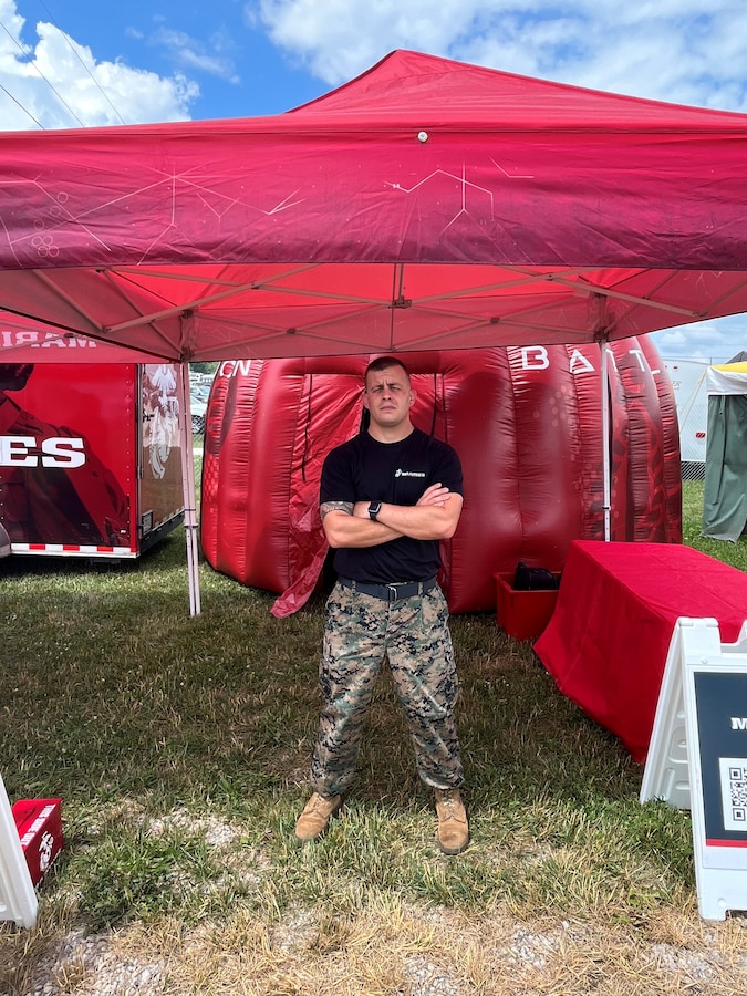 U.S. Marine Corps Sgt. Zachary Will, an enhanced marketing vehicle (EMV) noncommissioned officer at 4th Marine Corps District, represents the Marine Corps during the Country Concert in Columbus, Ohio, July 7, 2023. The event provided the Marines the opportunity to connect with the local community and raise Marine Corps awareness. (U.S. Marine Corps photo by courtesy)