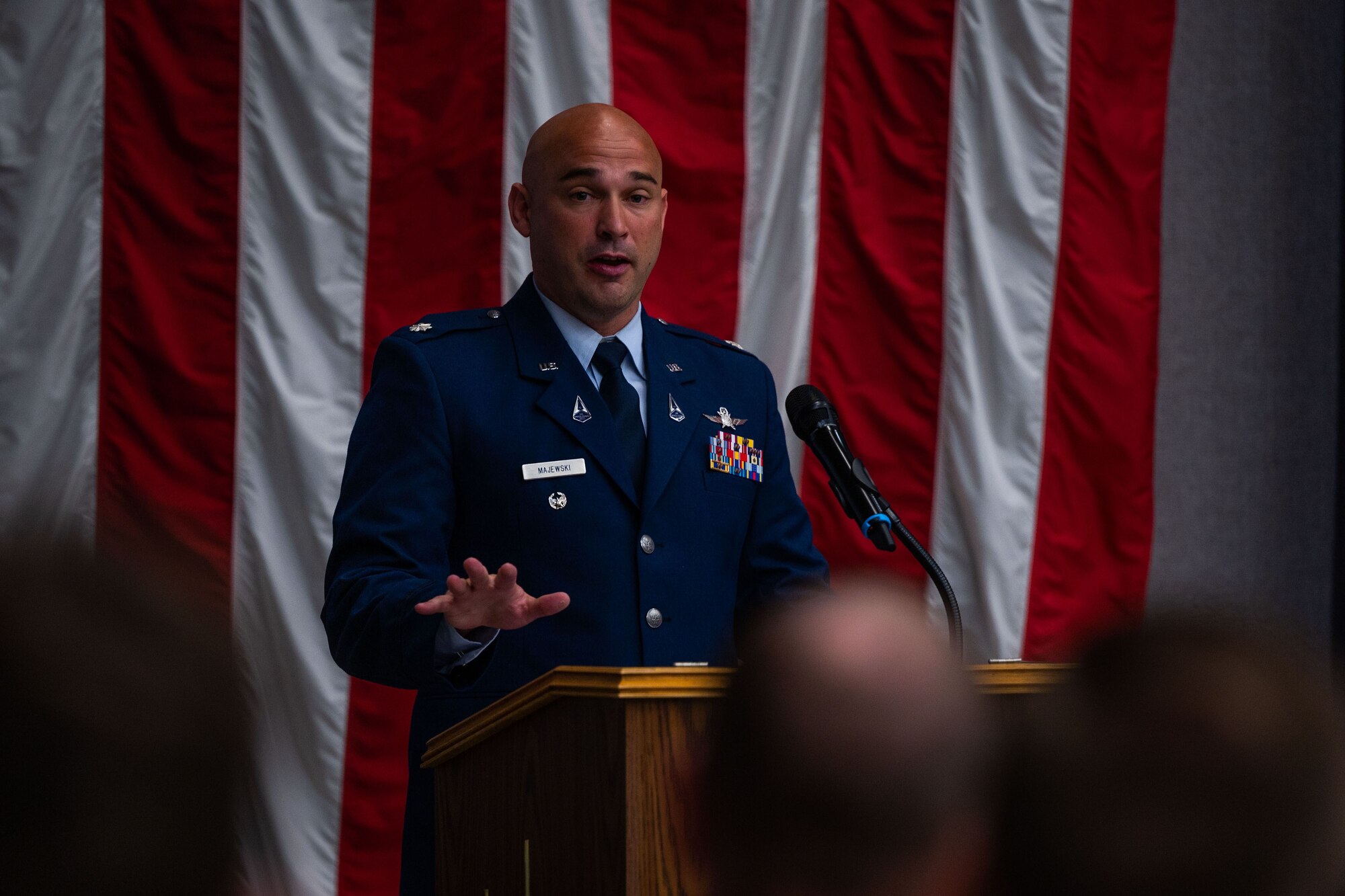 U.S. Space Force Lt. Col. Jacob Majewski, incoming 65th Cyberspace Squadron (65 CYS) commander, speaks at a podium during the 65 CYS change of command ceremony at Vandenberg Space Force Base, Calif., July 21, 2023. (U.S. Space Force photo by Tech. Sgt. Luke Kitterman)