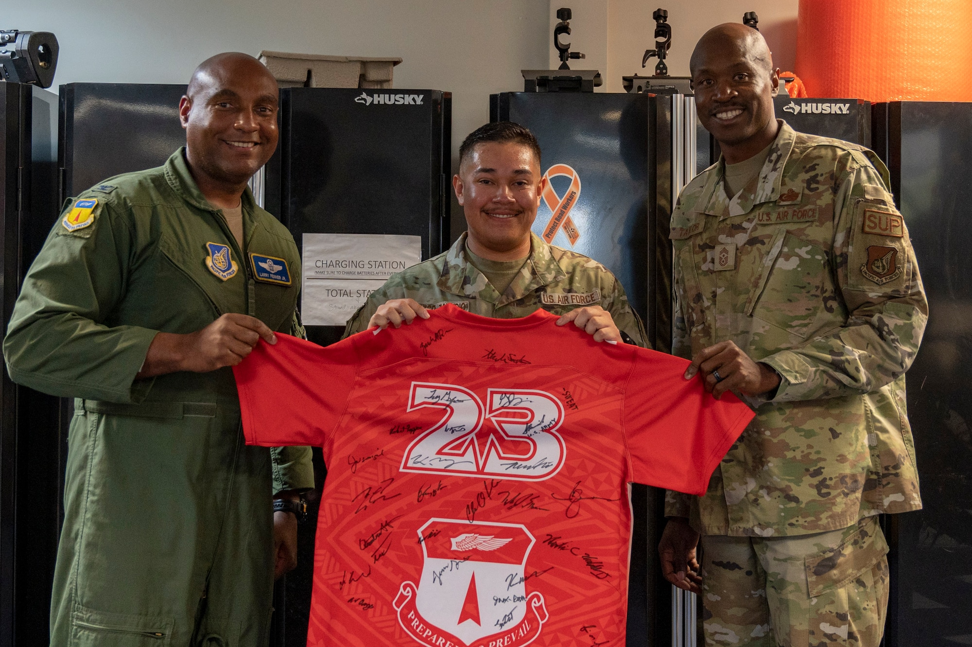 U.S. Air Force Staff Sgt. Abraham Orozco-Zamudio, a heating, ventilation, air conditioning and refrigeration planner assigned to the 554th Rapid Engineer Deployable Heavy Operational Repair Squadron Engineer, receives the Linebacker of the Week Award from U.S. Air Force Col. Larry Fenner, vice commander of the 36th Wing, and U.S. Air Force Chief Master Sgt. Nicholas Taylor, the command chief of the 36th Wing, at the Pacific Regional Training Center - Andersen, Guam, July 19, 2023. The Team Andersen Linebacker of the Week recognizes outstanding enlisted, officer, civilian and total force personnel who have had an impact on achieving Team Andersen’s mission, vision and priorities. (U.S. Air Force photo by Airman 1st Class Emily Saxton)