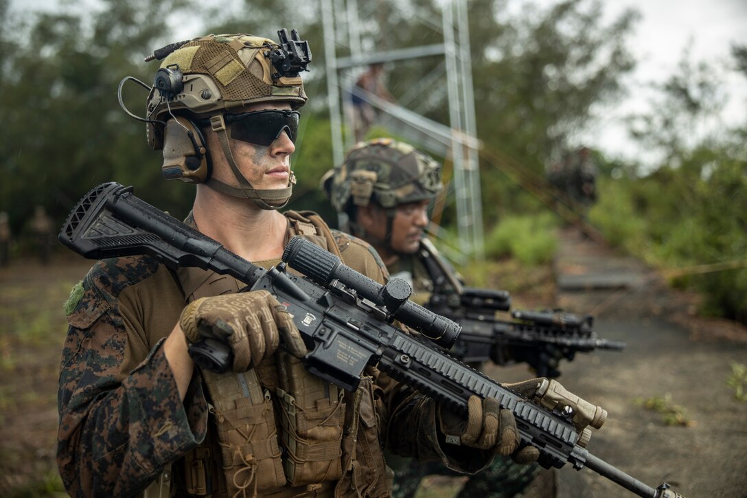 U.S. Marine Corps 1st Lt. Ryan Berry, a platoon commander with 3d Littoral Combat Team, 3d Marine Littoral Regiment, 3d Marine Division, sets security with an M27 Infantry Automatic Rifle alongside a Philippine Marine during the conduct of a simulated airfield seizure during Marine Aviation Support Activity 23 at Parades Air Station, Philippines, July 13, 2023. MASA is a bilateral exercise between the Armed Forces of the Philippines and the U.S. Marine Corps, aimed at enhancing interoperability and coordination focused on aviation-related capabilities. During MASA 23, Armed Forces of the Philippines and U.S. Marines conduct approximately twenty different training evolutions, including live-fire, air assaults, and subject matter expert exchanges across aviation, ground, and logistics capabilities.