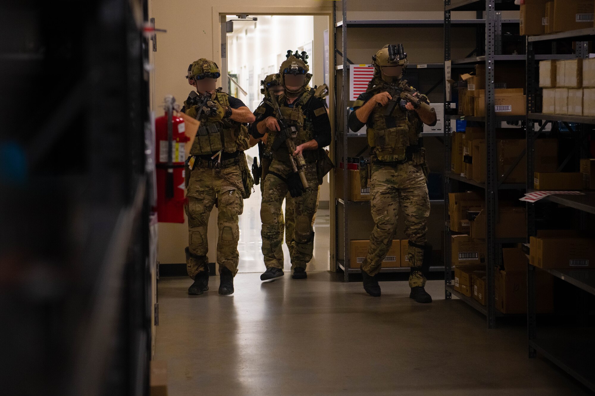 Green berets enter a storage room