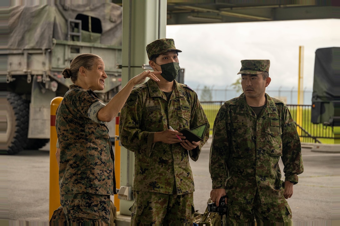 U.S. Navy Lt. Cmdr. Betsy Mramor, left, a family medicine doctor from 3rd Medical Battalion, discusses the use and effectiveness of a Role-1 Medical Facility to Japan Ground Self Defense Force medics at Combined Arms Training Center Fuji, Shizuoka, Japan, June 22, 2023. The JGSDF and Navy met to demonstrate damage control and resuscitation techniques and increase operational understanding between the JGSDF and the U.S. Navy. (U.S. Marine Corps photo by Lance Cpl Federico Marquez)