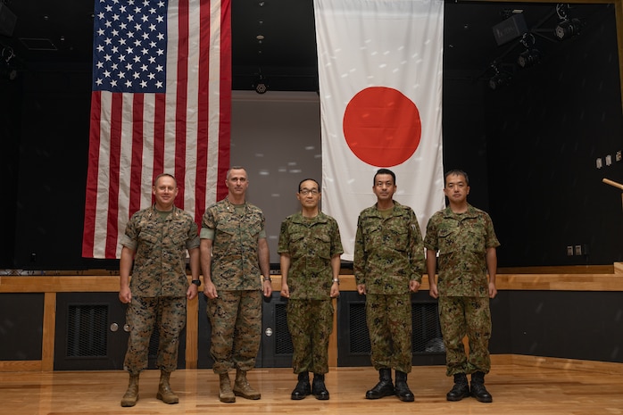 U.S. Marine Corps and Japanese Ground Self-Defense Force leadership pose for a photo during an opening ceremony for exercise Resolute Dragon 23 at Camp Kinser, Okinawa, Japan, July 9, 2023. Resolute Dragon 23 is an annual exercise for the III Marine Expeditionary Force, designed to strengthen the defensive capabilities of the U.S.-Japan alliance by demonstrating integrated command and control, targeting, combined arms, and maneuver across multiple domains, as part of the Stand-in-Force. (U.S. Marine Corps photo by Cpl. Sydni Jessee)