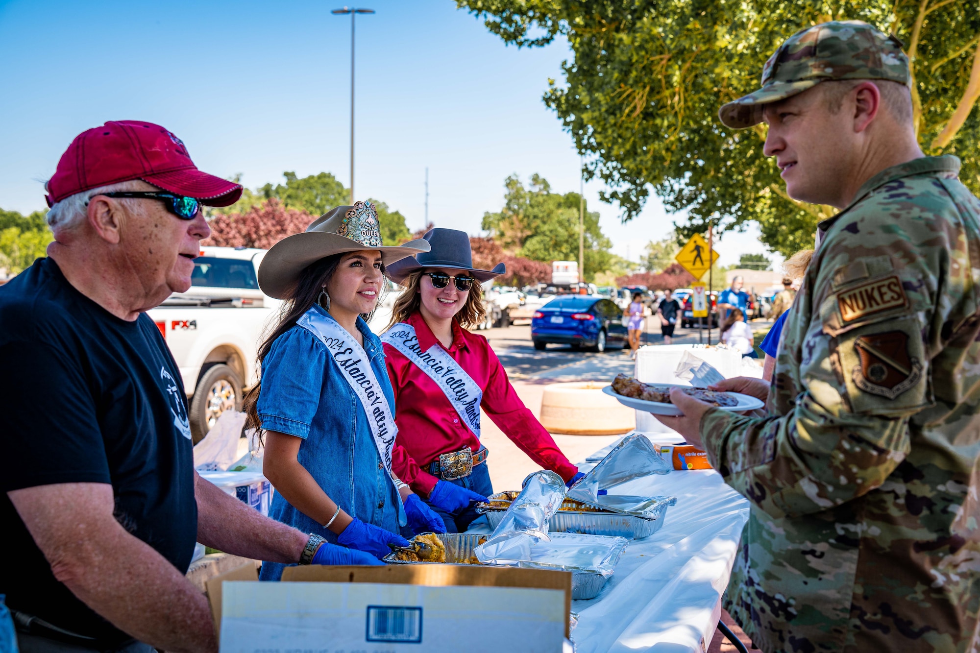 People serve food.