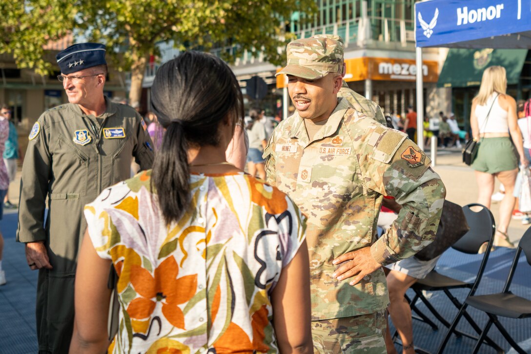 Photo of people engaged in conversation.