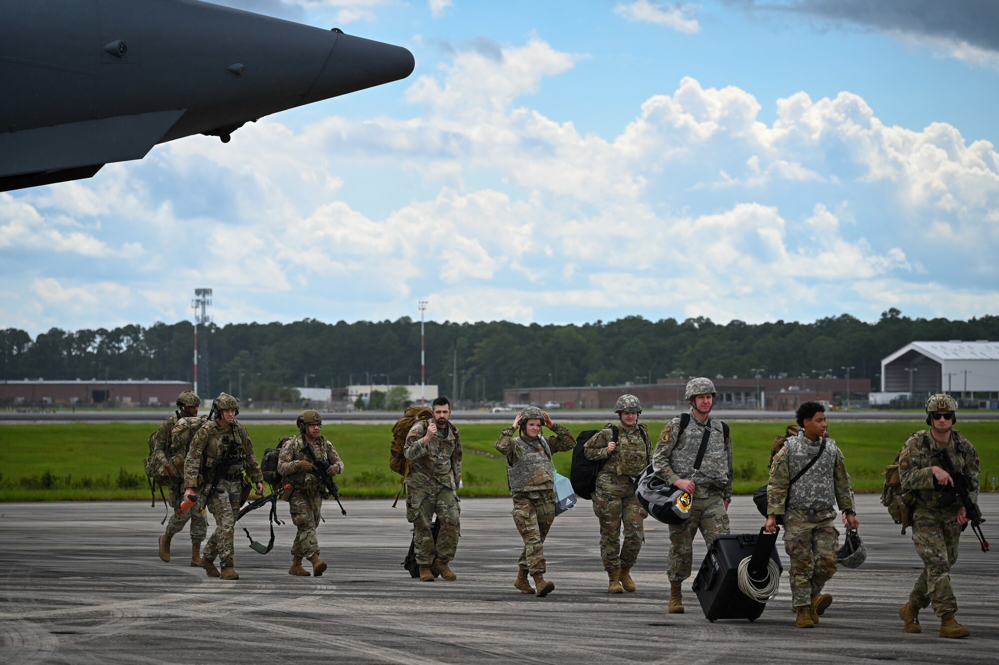 Airmen assigned to 4th Fighter Wing, Seymour Johnson Air Force Base, North Carolina, walk off the flight line to inprocess after landing at Marine Corps Air Station Cherry Point, North Carolina, July 24, 2023. RT-23 hosted employed air combat capabilities of approximately 45 aircraft from several active and reservist Air Force and Marine Corps commands and for the first time, the F-35B Lightning II assigned to Marine Aircraft Group 31 and MAG-14 (U.S. Air Force photo by Airman 1st Class Leighton Lucero)