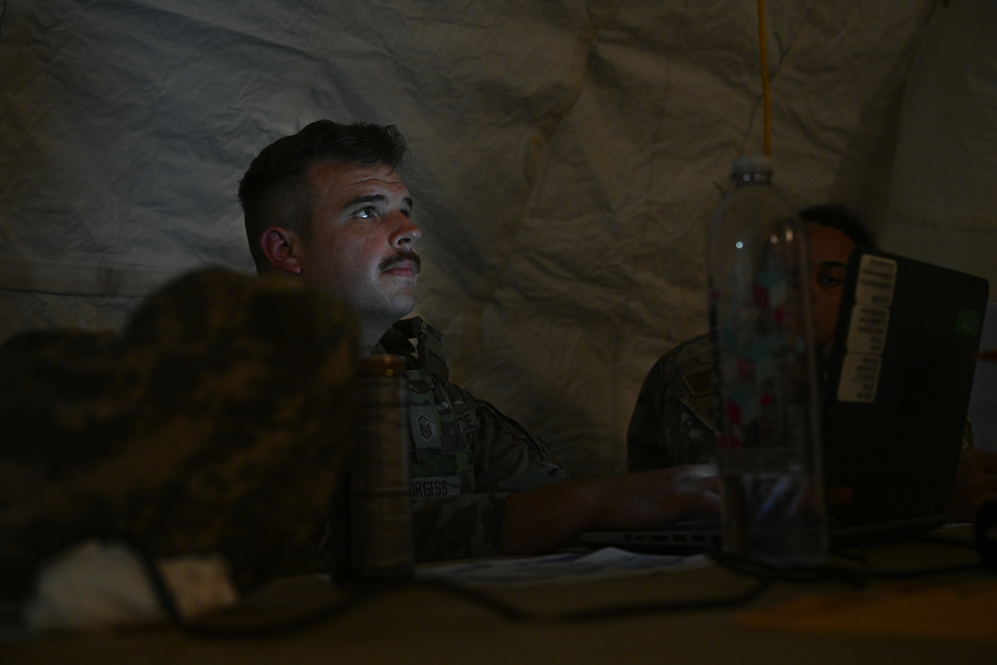 Master Sgt. Jared Burgess,4th Force Support Squadron personnel support for contingency operations team chief, in-processes Airmen during Razor Talon 23-1 at Marine Corps Air Station Cherry Point, North Carolina, July 24, 2023. RT-23 is an agile combat employment focused exercise, designed to test the 4th Fighter Wing’s ability to operate as a lead wing to generate combat airpower while continuing to move, maneuver, sustain the wing and subordinate force elements in a dynamic contested environment. (U.S. Air Force photo by Staff Sgt. Koby I. Saunders)