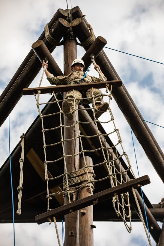 A U.S. Army cadet climbs the Alpine Tower while attending Cadet Summer Training at Fort Knox, Kentucky, July 20, 2023. Soldiers and noncommissioned officers of the 1st Infantry Division traveled to CST to train future U.S. Army leaders. (U.S. Army photo by Spc. Charles Leitner)