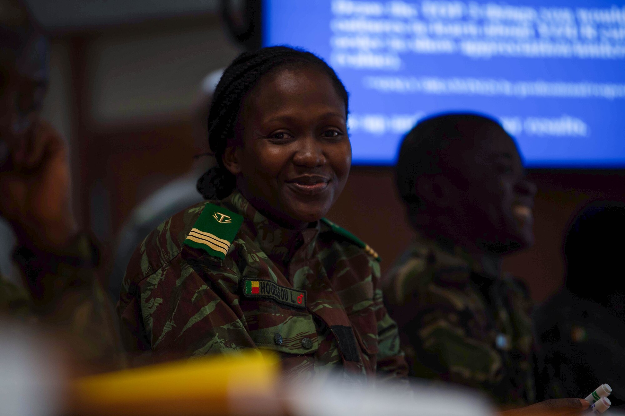 Benin Armed Forces Capt. Laurine Houessou, Inter-African Professional Development Seminar student, smiles during a cross-cultural competence brief conducted by her peers at Kapaun Air Station, Germany, July 18, 2023.