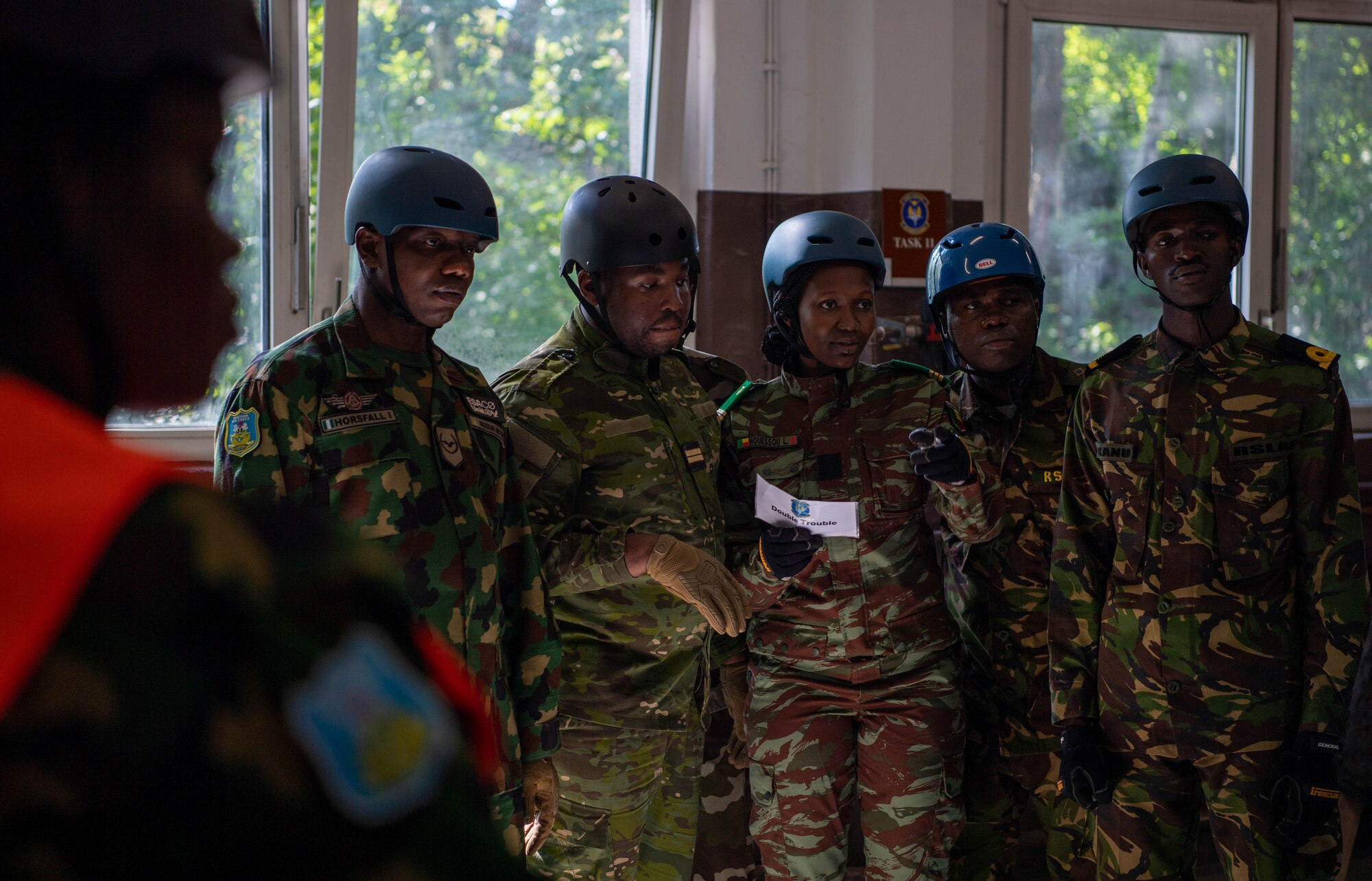 Benin Armed Forces Capt. Laurine Houessou, Inter-African Professional Development Seminar student, goes over obstacle instructions during a team building exercise at Kapaun Air Station, Germany, July 19, 2023.