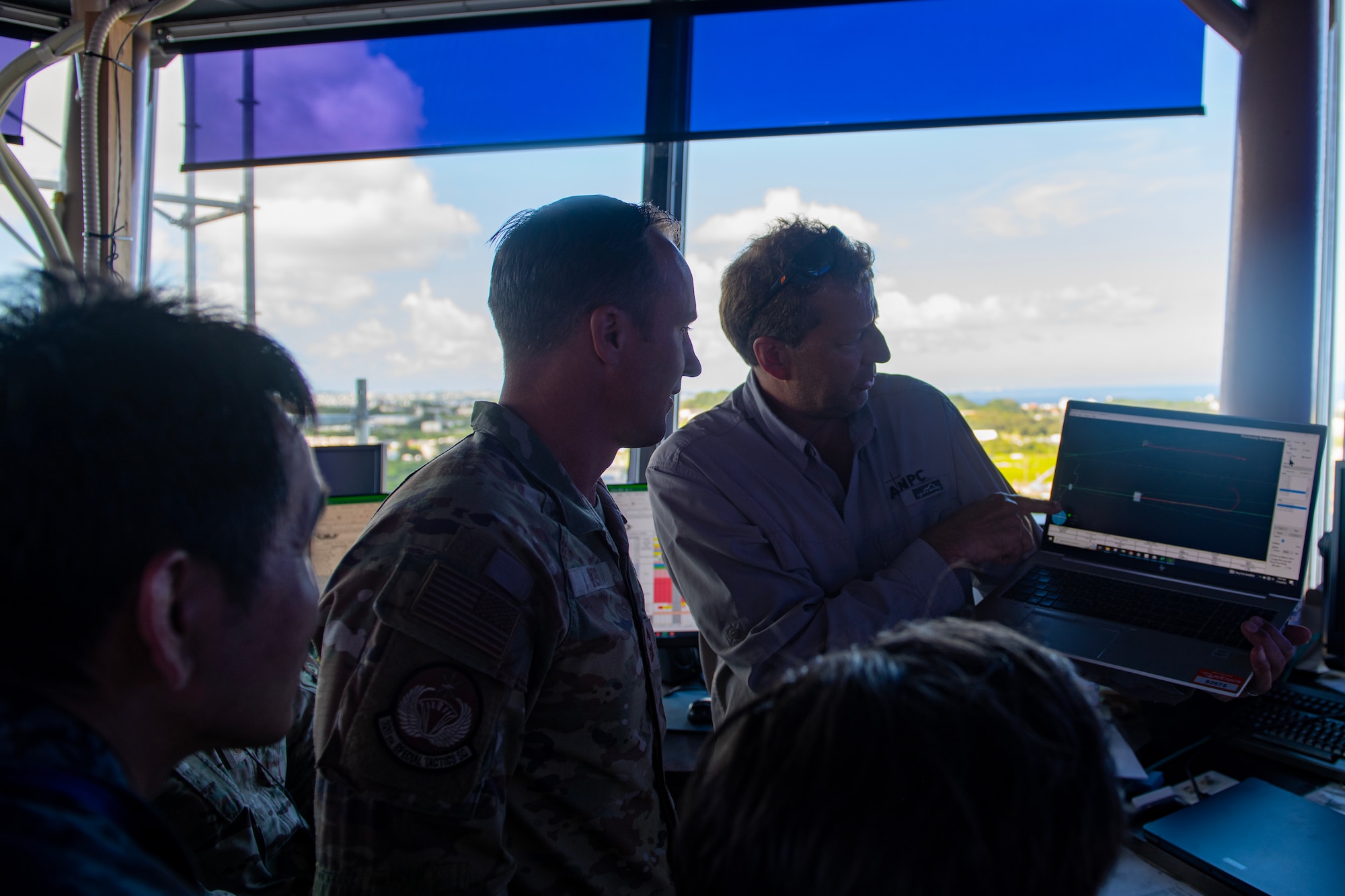 Chief Master Sgt with the 320th listens to a Transportable Transponder Landing System briefing.