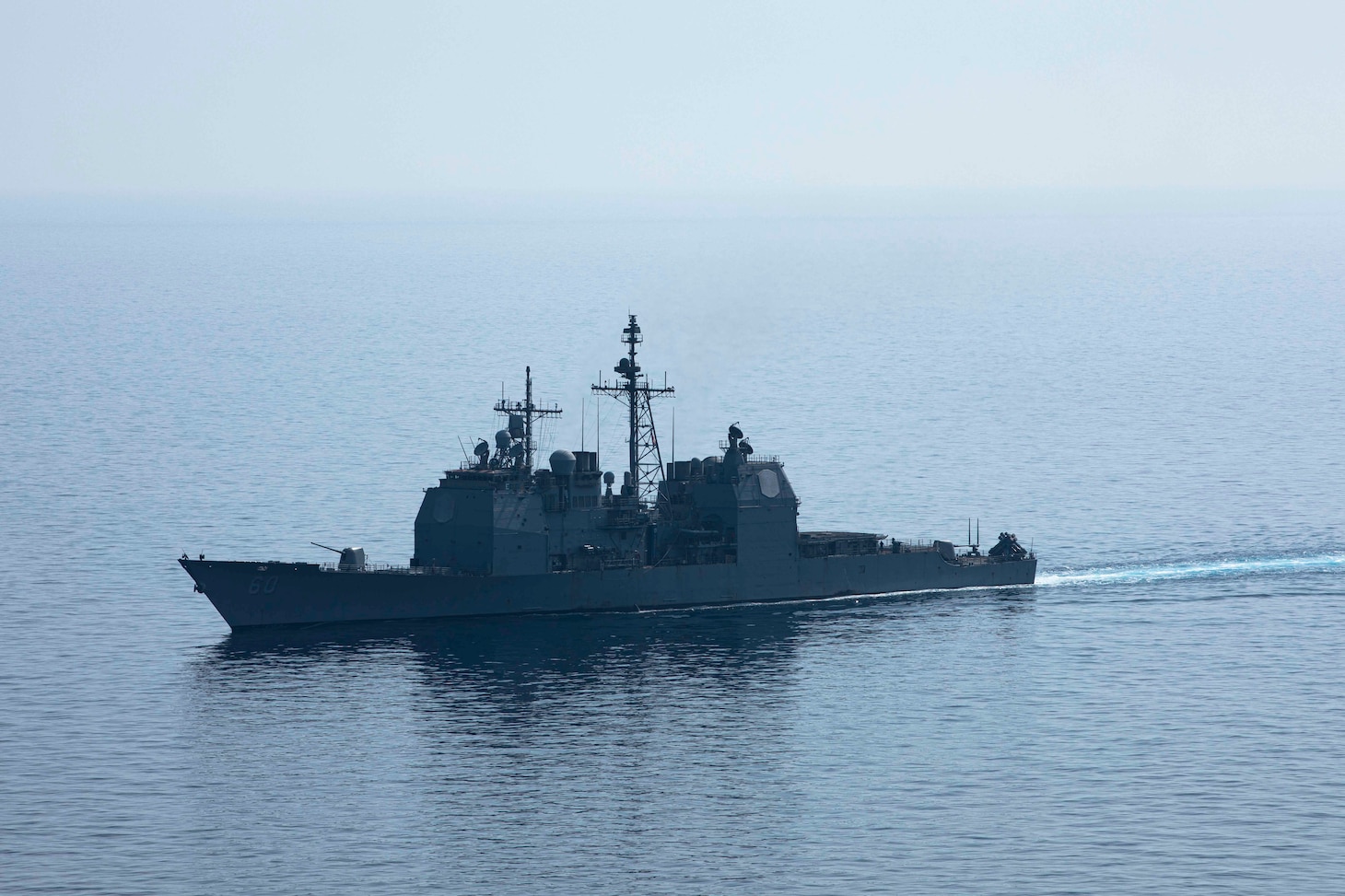 230711-N-LK647-1727 ADRIATIC SEA (July 11, 2023) The Ticonderoga-class guided missile cruiser USS Normandy (CG 60) breaks formation following a photo exercise, July 11, 2023. Normandy is part of the Gerald R. Ford Carrier Strike Group and is on a scheduled deployment in the U.S. Naval Forces Europe area of operations, employed by Sixth Fleet to defend U.S., allied, and partner interests. GRFCSG is currently participating in Neptune Strike, a multiyear effort focused on harmonizing U.S. and NATO planning teams to transfer command and control of Allied naval and amphibious forces to STRIKFORNATO, in order to provide assurance, deterrence, and collective defense for the Alliance. (U.S. Navy photo by Mass Communication Specialist 2nd Class Malachi Lakey)