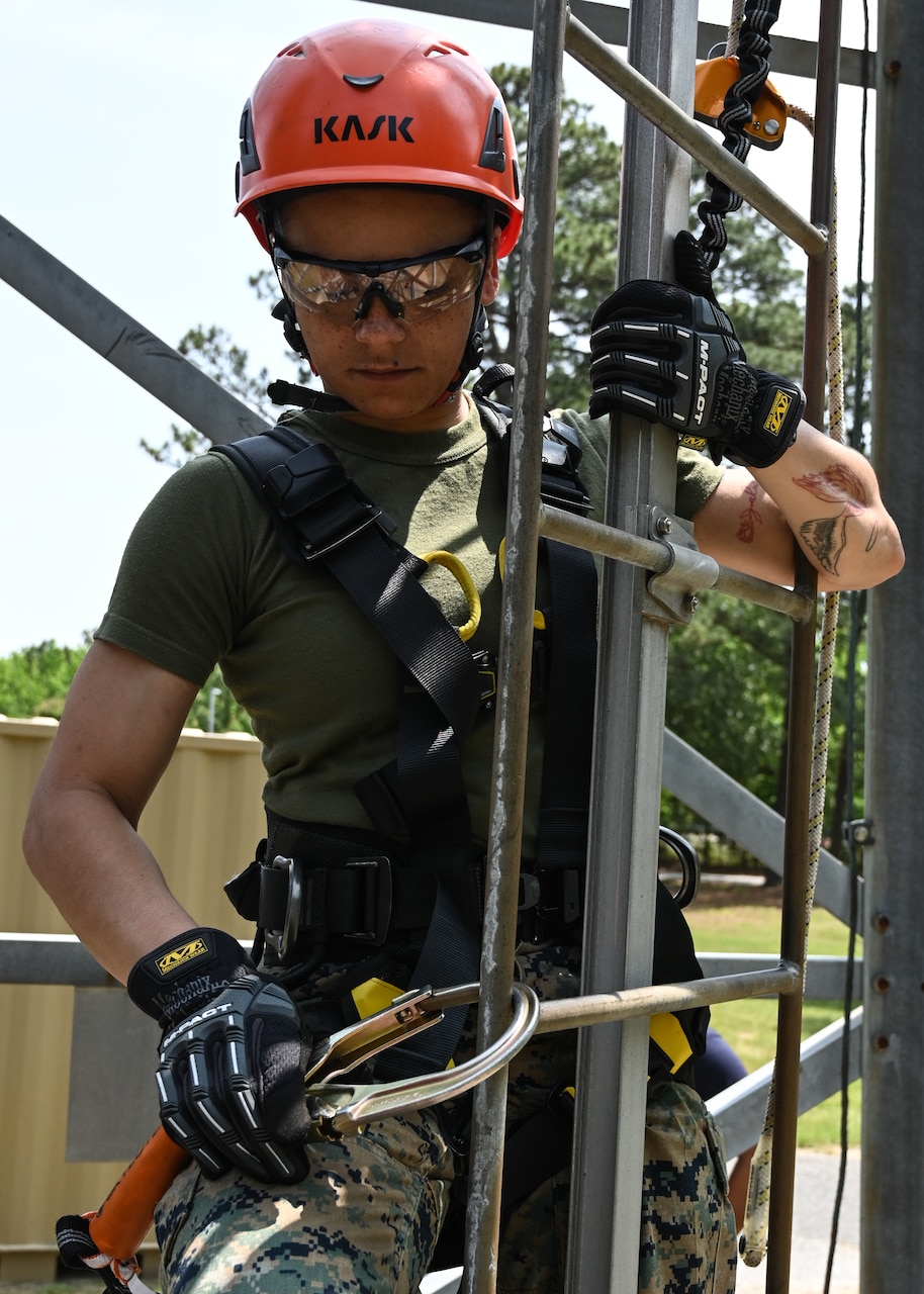 Little Boy Connecting His Safety Rope and Hook before Climbing Up