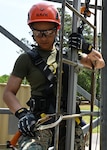 NORFOLK (May 11, 2023) Marine Corps Staff Sgt. Ashley Leachman, assigned to Marine Aviation Logistics Squadron 12, attaches a lifeline hook to a ladder as part of the Competent Person for Fall Protection Course. The Naval Safety and Environmental Training Center holds the Competent Person for Fall Protection Course to train and equip Navy personnel with the knowledge and skills needed to prepare and implement fall protection and prevention plans, and fall-arrest rescue plans and procedures. (U.S. Navy photo by Mass Communication Specialist 1st Class (SW/AW) Weston A. Mohr)
