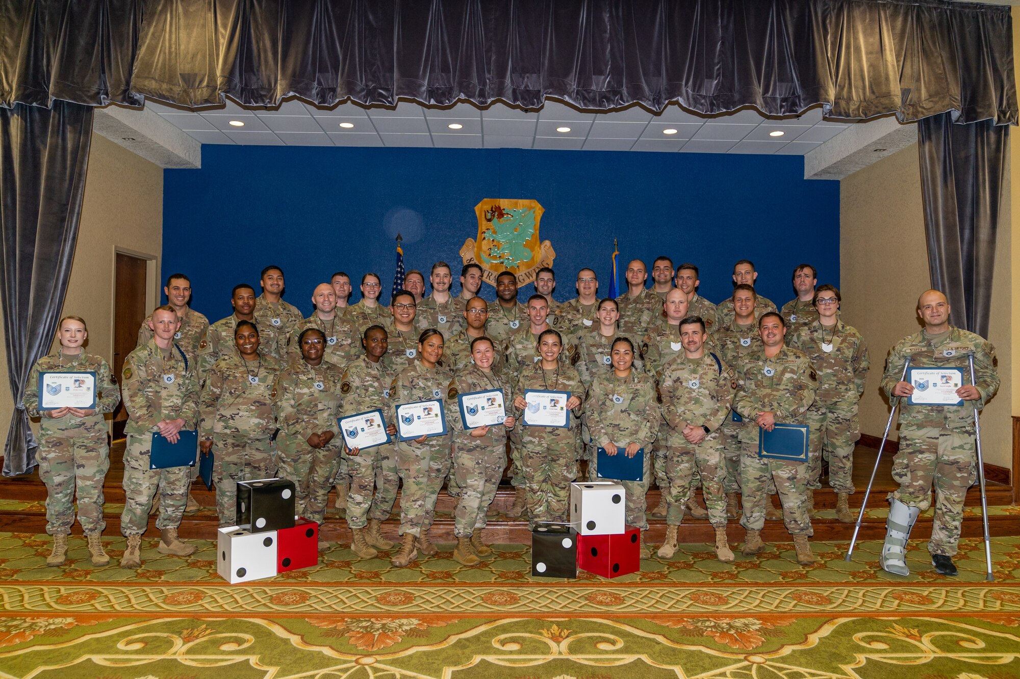 Technical sergeant selectees from the 81st Training Wing pose for a group photo during the technical sergeant release party at Keesler Air Force Base, Mississippi, June 12, 2023.