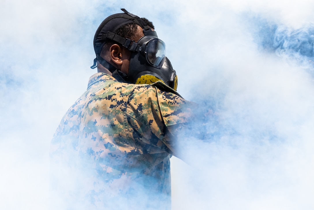 U.S. Marine Corps Lance Cpl. Babatunde Banjo, a chemical, biological, radiological, and nuclear defense specialist assigned to Marine Wing Support Squadron 171, employs a CS Riot Control Gas Canister at Combined Arms Training Center Camp Fuji, Japan, July 16, 2023. Eagle Wrath is an annual exercise designed to increase squadron proficiency in conducting real-world contingency missions as a forward-postured squadron in the Indo-Pacific.