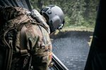 Washington National Guard Sgt. Nathan Smart a member of B Company, 1st Battalion, 168th General Support Aviation, checks the water bucket level during wildfire air operations training  June 6, 2021, at Joint-Base Lewis McChord, Washington.