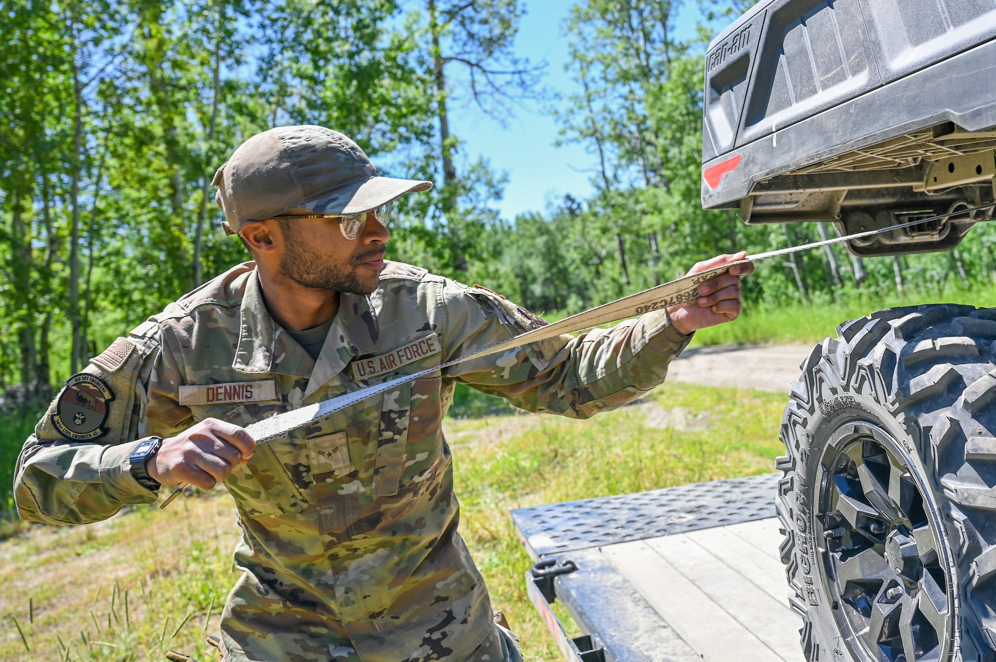 An Airman pulls on a rope