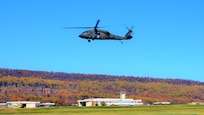 A UH-60 Black Hawk helicopter from the 28th Expeditionary Combat Aviation Brigade flies over Muir Army Airfield at Fort Indiantown Gap, Pa., on Nov. 10, 2021. (Pennsylvania National Guard photo by Brad Rhen)