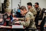 Members of the Oklahoma National Guard cybersecurity team work together to defend networks during Cyber Shield 2023 at the Professional Education Center in Little Rock, Arkansas, June 10, 2023. Oklahoma Guardsmen joined approximately 800 military and civilian cyber professionals from 35 states, including international partners, for this year’s Cyber Shield June 2-16.