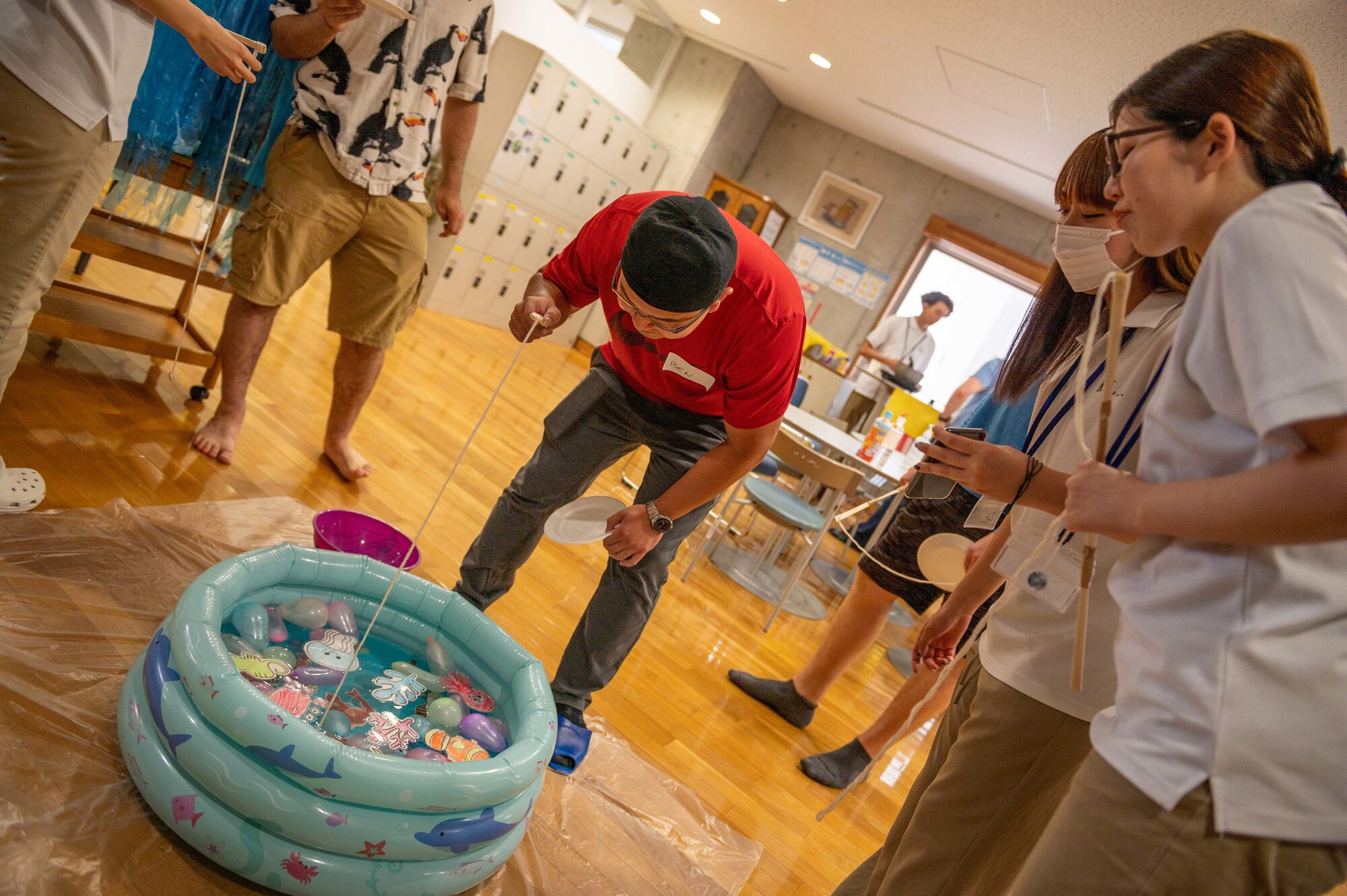 Kadena Language Institute students teach Japanese summer festival games to U.S. Air Force volunteers