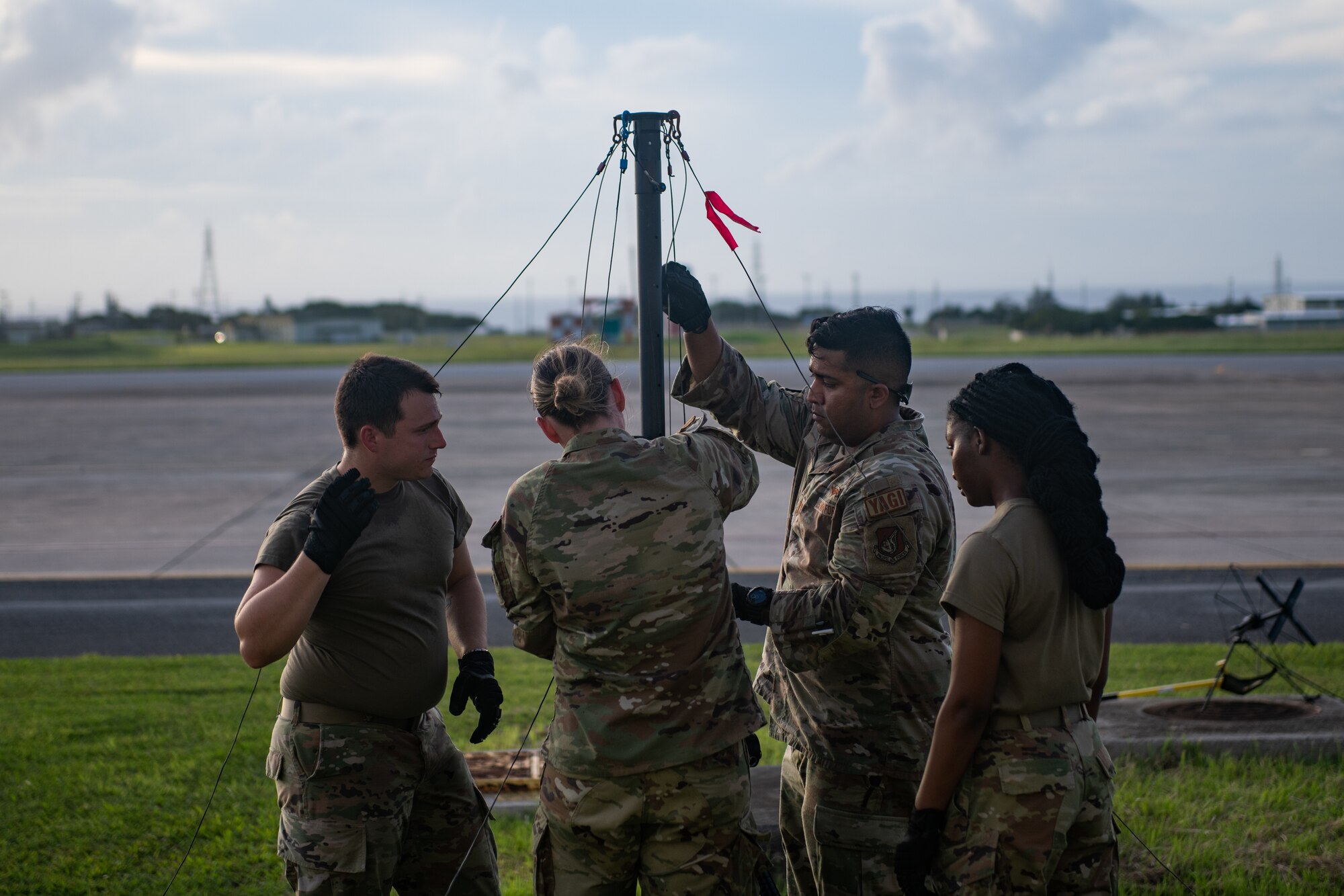 Airmen set up a radio antenna.