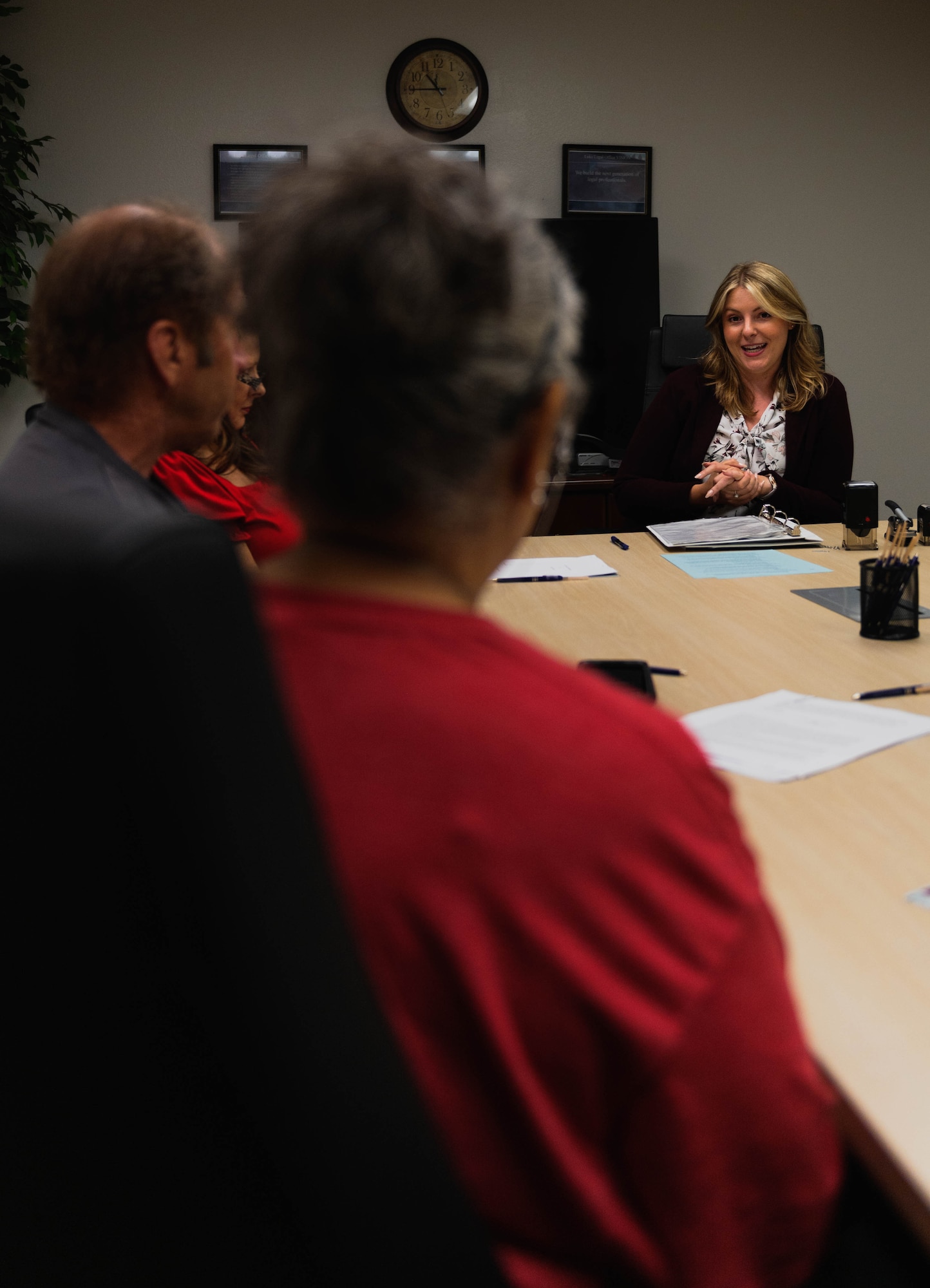 Demetria Themistocles, 56th Fighter Wing Judge Advocate Exceptional Family Member Program attorney advisor, speaks to clients, July 26, 2023, at Luke Air Force Base, Arizona.